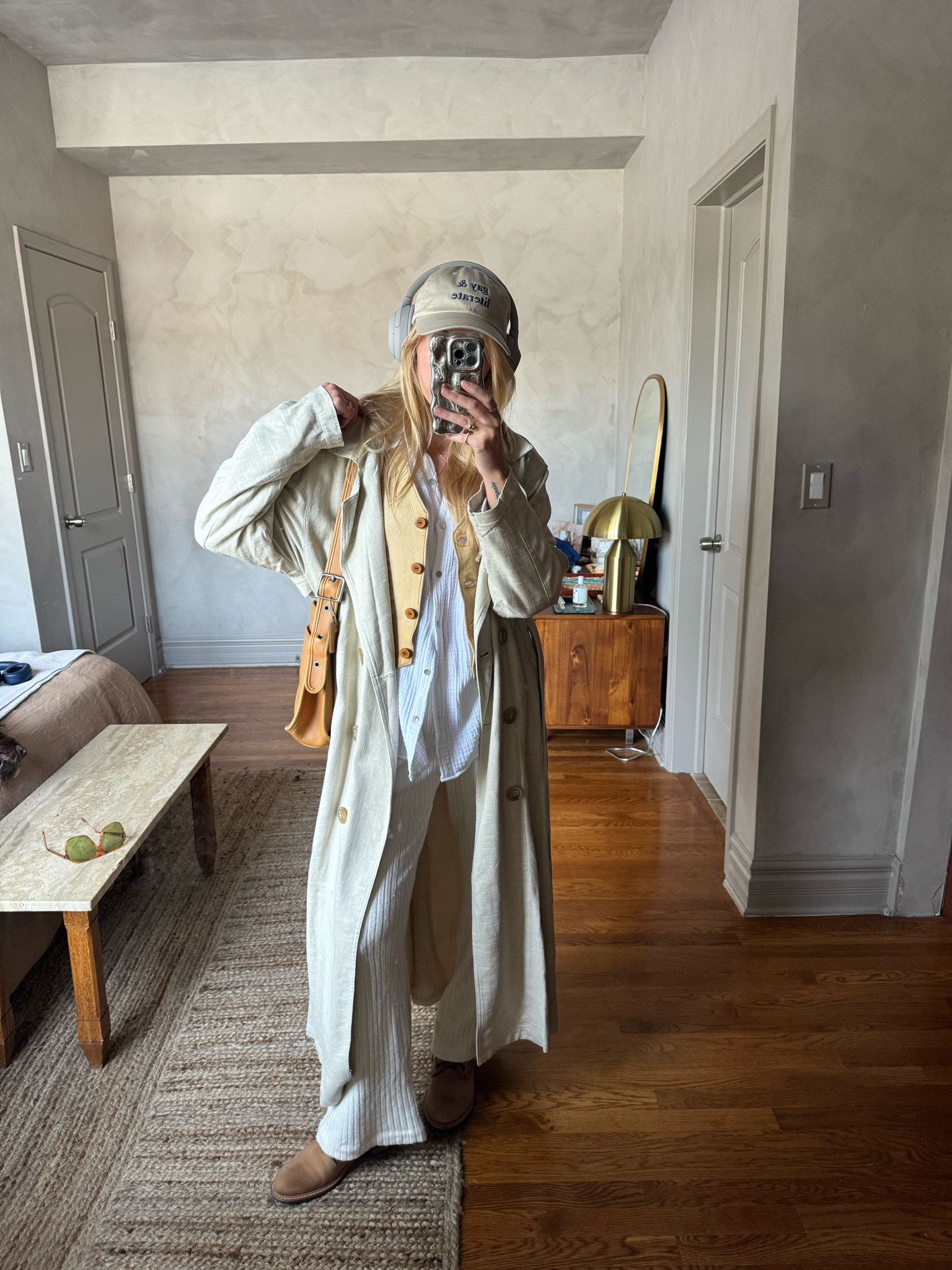 Hat is SapphLit, pants are Donni, vest is vintage, bag is vintage coach 