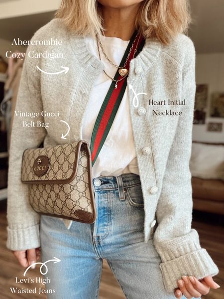 Casual fall outfit of the day! It’s all about the details! I love this cozy Abercrombie cardigan. I styled it with a Gucci belt bag, heart initial necklace, a pair of Levi jeans, and a casual white tee! 

#LTKstyletip