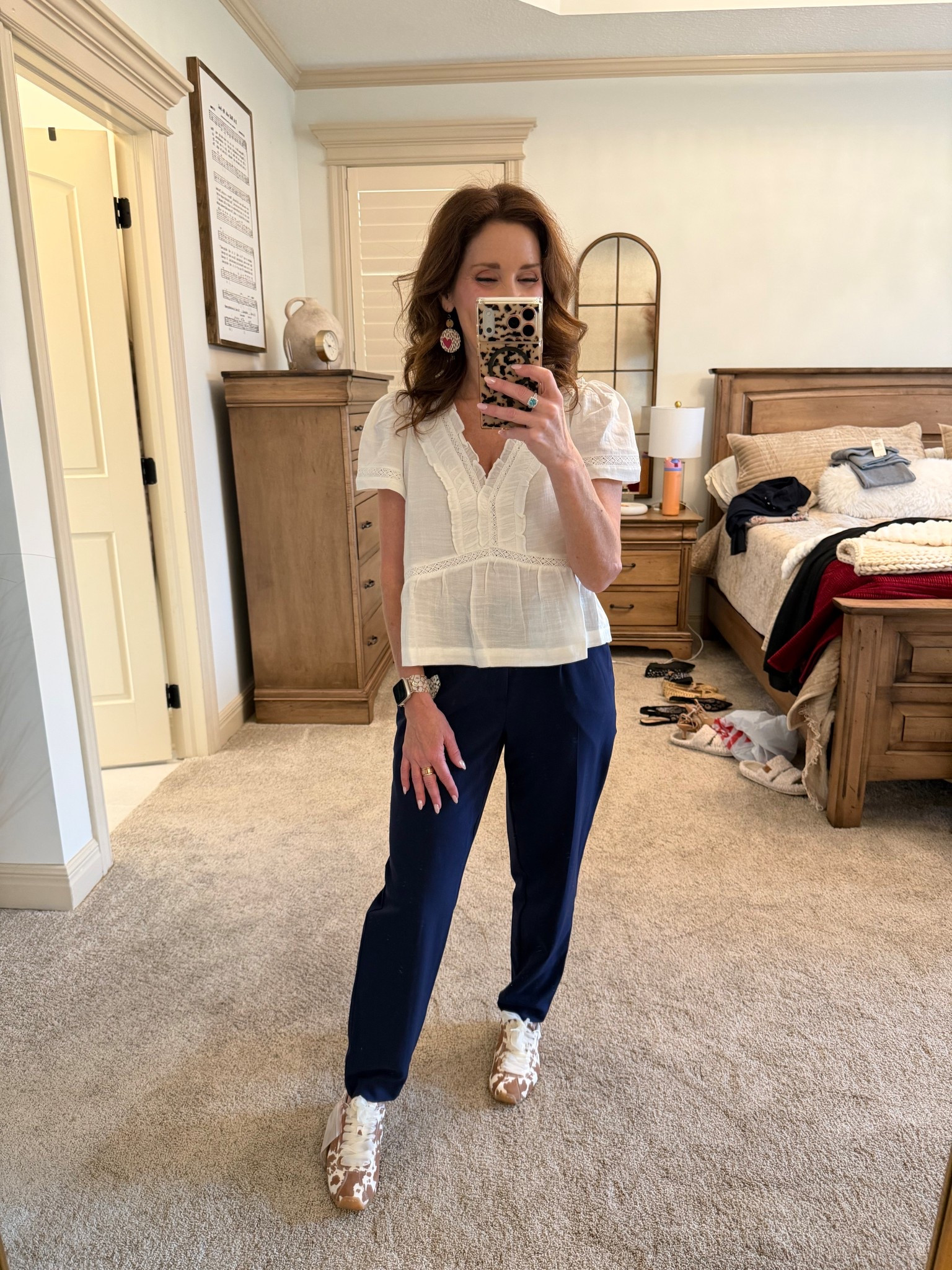 A peplum top with ankle pants and cow print sneakers is my kind of everyday outfit!

#LTKSeasonal #LTKOver40 #LTKootd
