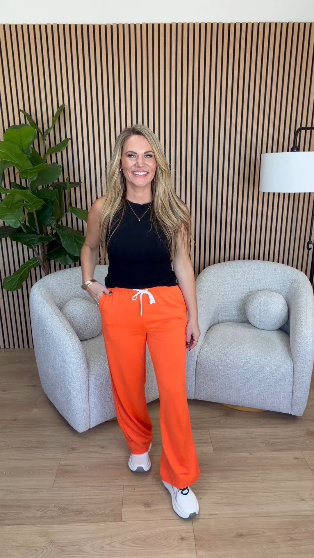 Adding a little color to my casual wardrobe! These bright orange drawstring lounge pants are such a fun find, and I love pairing them with a simple black sleeveless top. The relaxed wide leg fit makes them great for lounging, traveling, or running errands. Add your favorite sneakers and you have an easy casual outfit that still has a little personality!

Sizing: 5’3” | Small top | Medium pants | Size 7.5 shoes

Orange lounge pants, bright orange sweatpants, black sleeveless tank top, wide leg drawstring pants, women’s casual athleisure, colorful lounge wear, casual weekend outfit, travel fashion, sporty casual outfit, petite fashion, Audrie Dollins