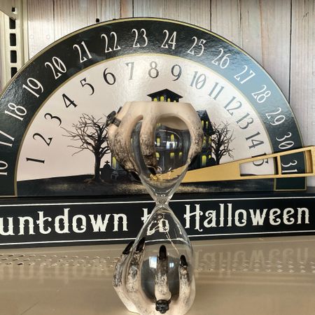 Decorate your home for Halloween with this fun countdown decoration by Ashland. Place it on your fireplace mantel and use it to countdown to the 31st of October.

Bring some witchy charm to your Halloween decorating with this tabletop hourglass from Ashland! Featuring spooky witch hands holding the glass, place on your coffee table next to a ceramic skull and candle for the perfect holiday décor.

#LTKfindsunder50 #LTKHalloween #LTKsalealert
