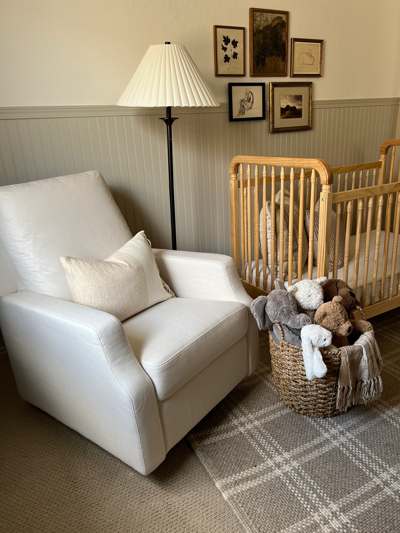 Neutral nursery styling 

Neutral spindle crib light natural wood upholstered glider white fabric check plaid throw pillow cover dark beige kilim stripe tan ivory pillow cover brown kantha quilt vintage framed art landscape vintage city brown rug Jellycat stuffed bunny doggy plaid drapery curtains vintage aged brass rocking horse arched mirror vintage childs chair iron floor lamp small faux tree 

#LTKhome #LTKFind #LTKunder100