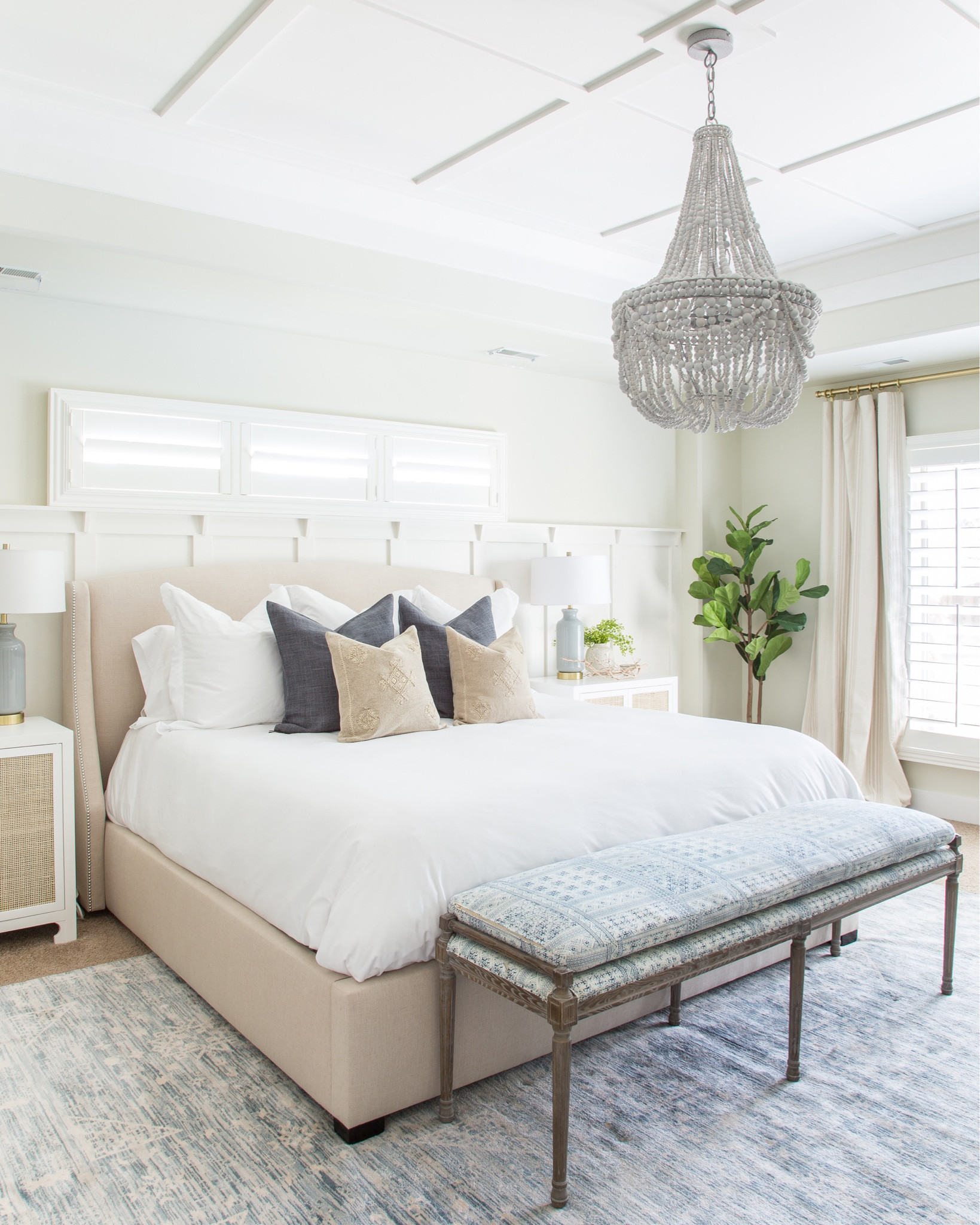 Fall decorating ideas in our master bedroom include a white duvet, blue linen pillows, embroidered pillows, a swoop wingback bed, a faux fiddle leaf fig tree, a blue glass table lamp and a white nightstand with rattan cane doors.  Other items include a wood beaded chandelier, a blue and white distressed rug, a blue and white batik upholstered bench, a brass curtain rod and striped linen curtains. 

simple decor, home decor, master bedroom decor, targetfanatic, target style, amazon finds, walmart home, bedroom bedding, long size bed, bedroom rugs, amazon home décor, amazon finds, amazon rugs, target bed, guest bedroom decor, studio mcgee, target finds, target home, master bedroom inspiration, guest bedroom inspo, bedroom benches, pottery barn bedroom, pottery barn bedding, coastal design, master bedroom, coastal bedroom, simple decorating, bedroom decorating #ltksalealert 

#LTKSeasonal #LTKunder50 #LTKunder100 #LTKhome #LTKfamily #LTKstyletip #LTKSeasonal #LTKfamily #LTKstyletip