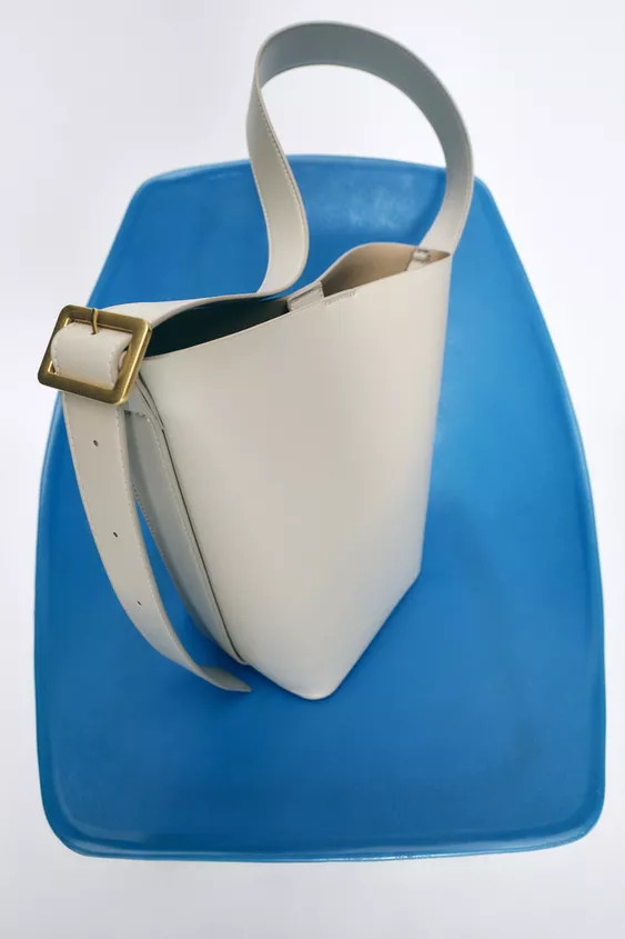 Bucket bag. Metal buckle detail at strap. Removable interior bag with zipper. Magnetic button clo... | Zara US