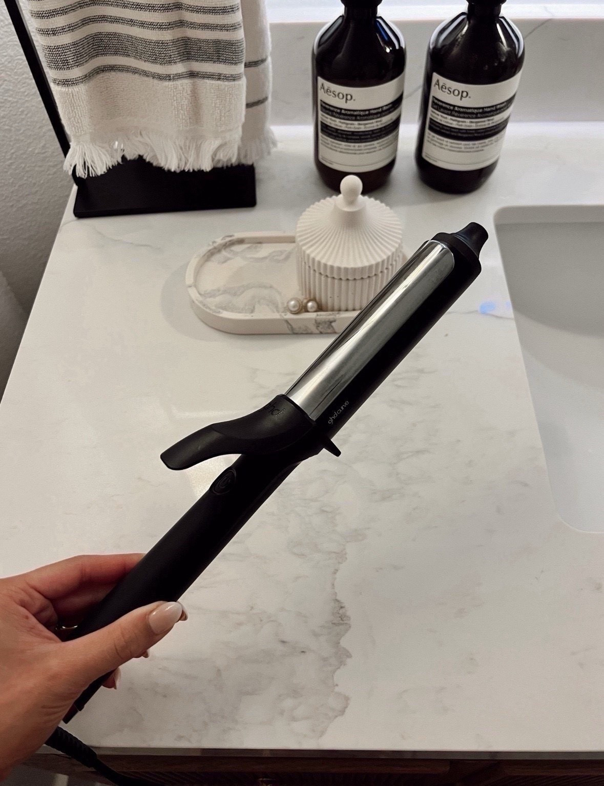 Ghd 1 1/4-inch curling iron that I have been loving lately!  Holds curl and easy to use 

#LTKBeauty