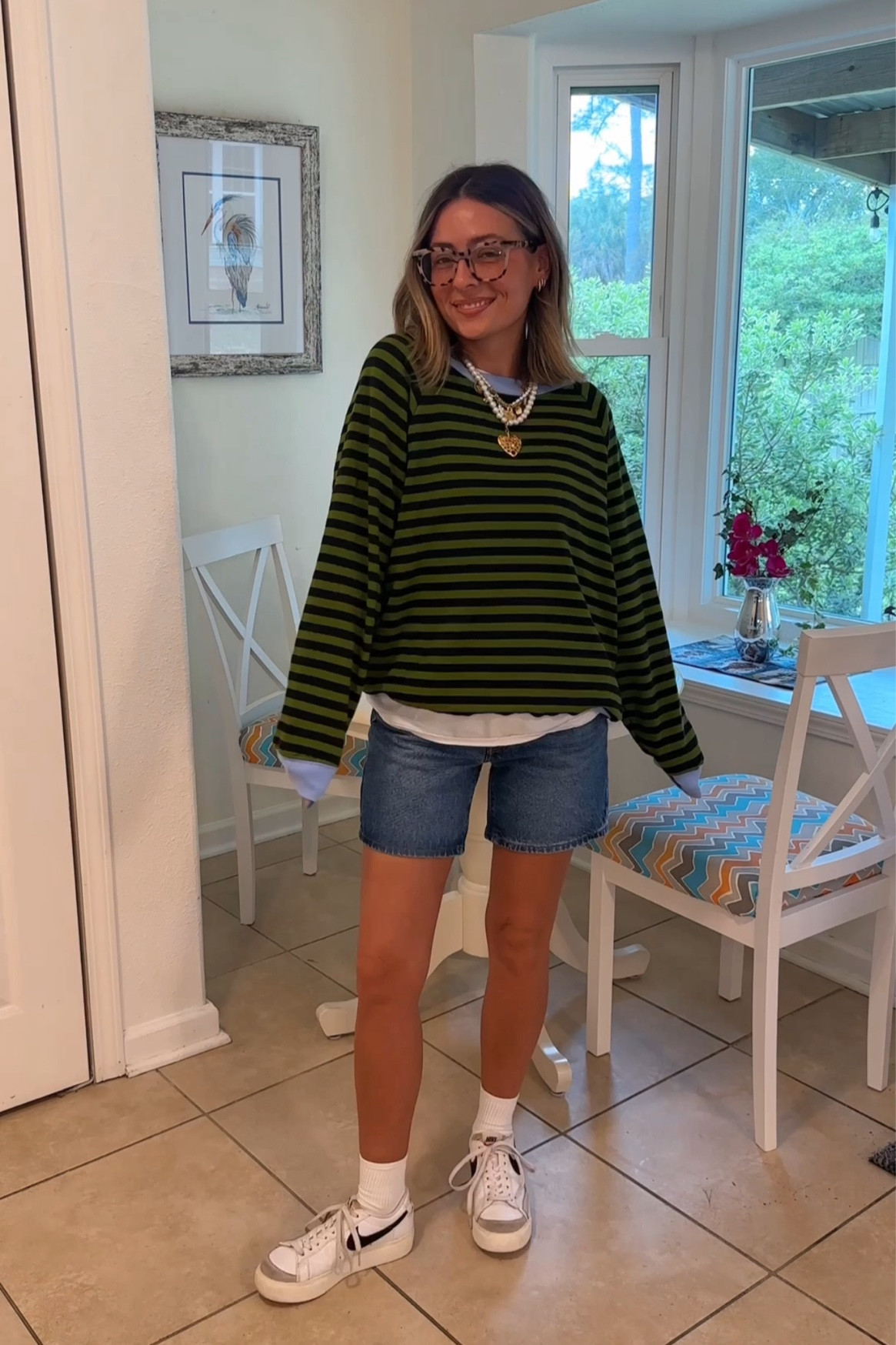 Wearing small in the pullover, medium in the undershirt and 25 in the shorts (size up)