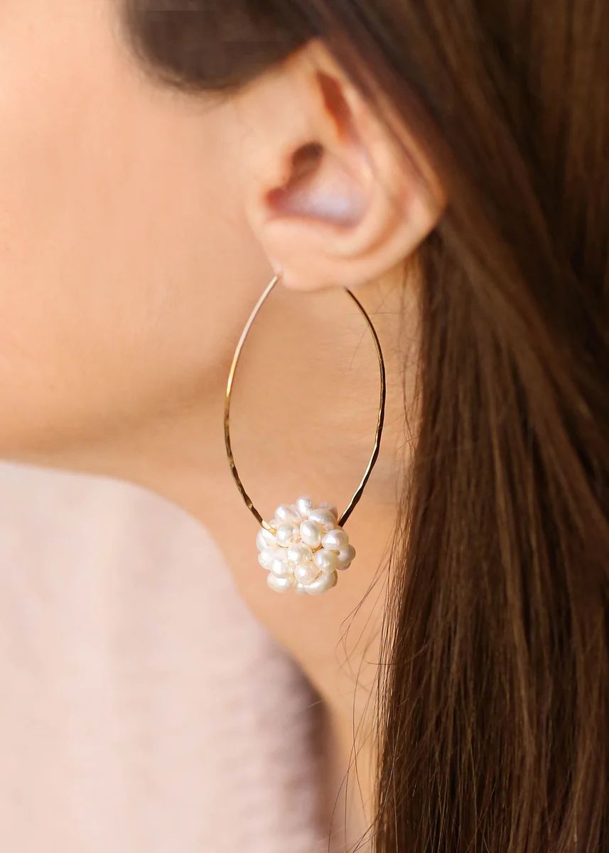 Pearl Flower Ball Hoops
	
		 
		$52.00
	
	$52.00

	

								DETAILS:
Pearls, Gold plated
Length... | Vivian Drew