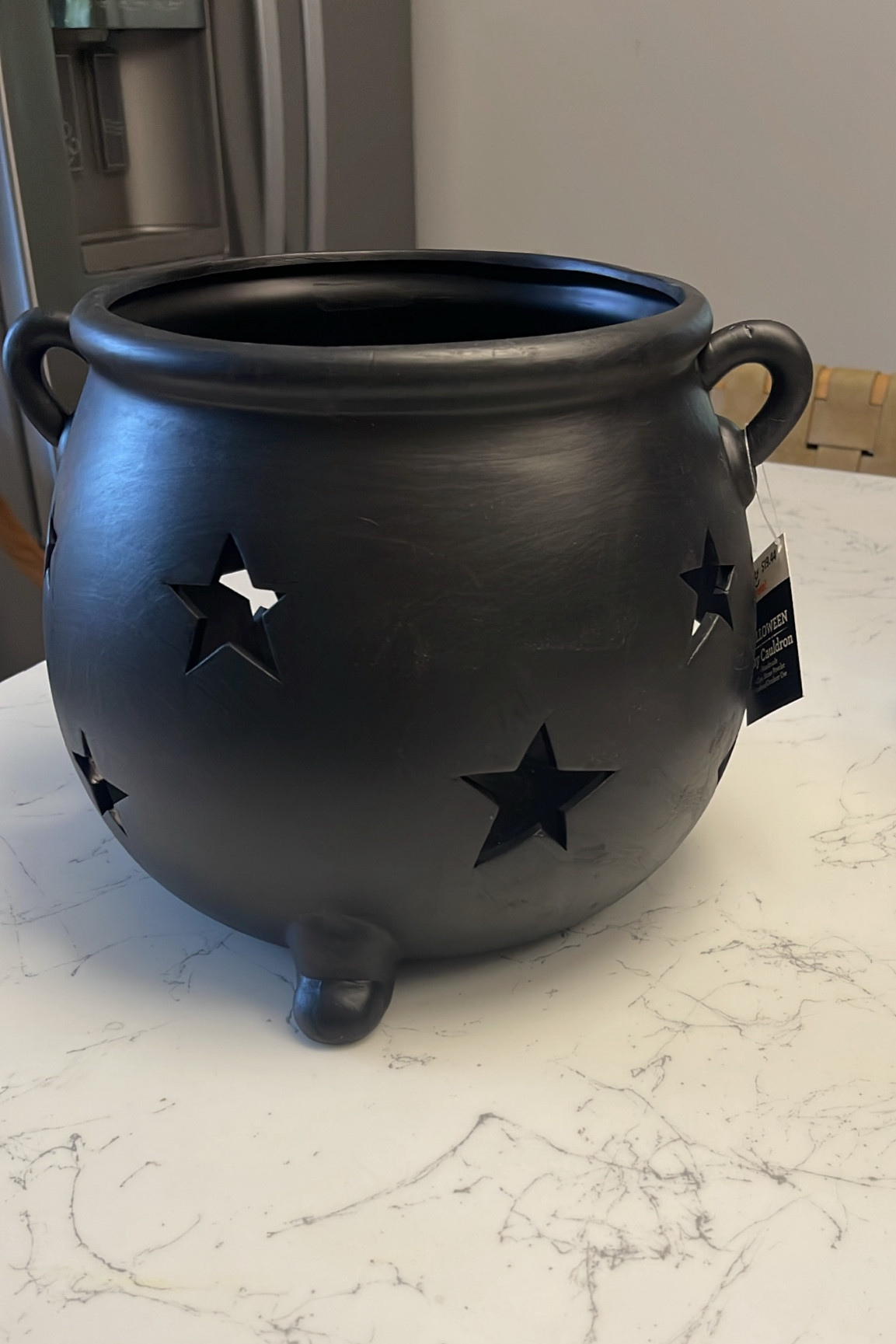 Clay cauldron with moon & star cutouts 
Indoor & outdoor use 

Add a  battery candle, twinkle lights or a diffuser 

#LTKHome #LTKFindsUnder50 #LTKSeasonal