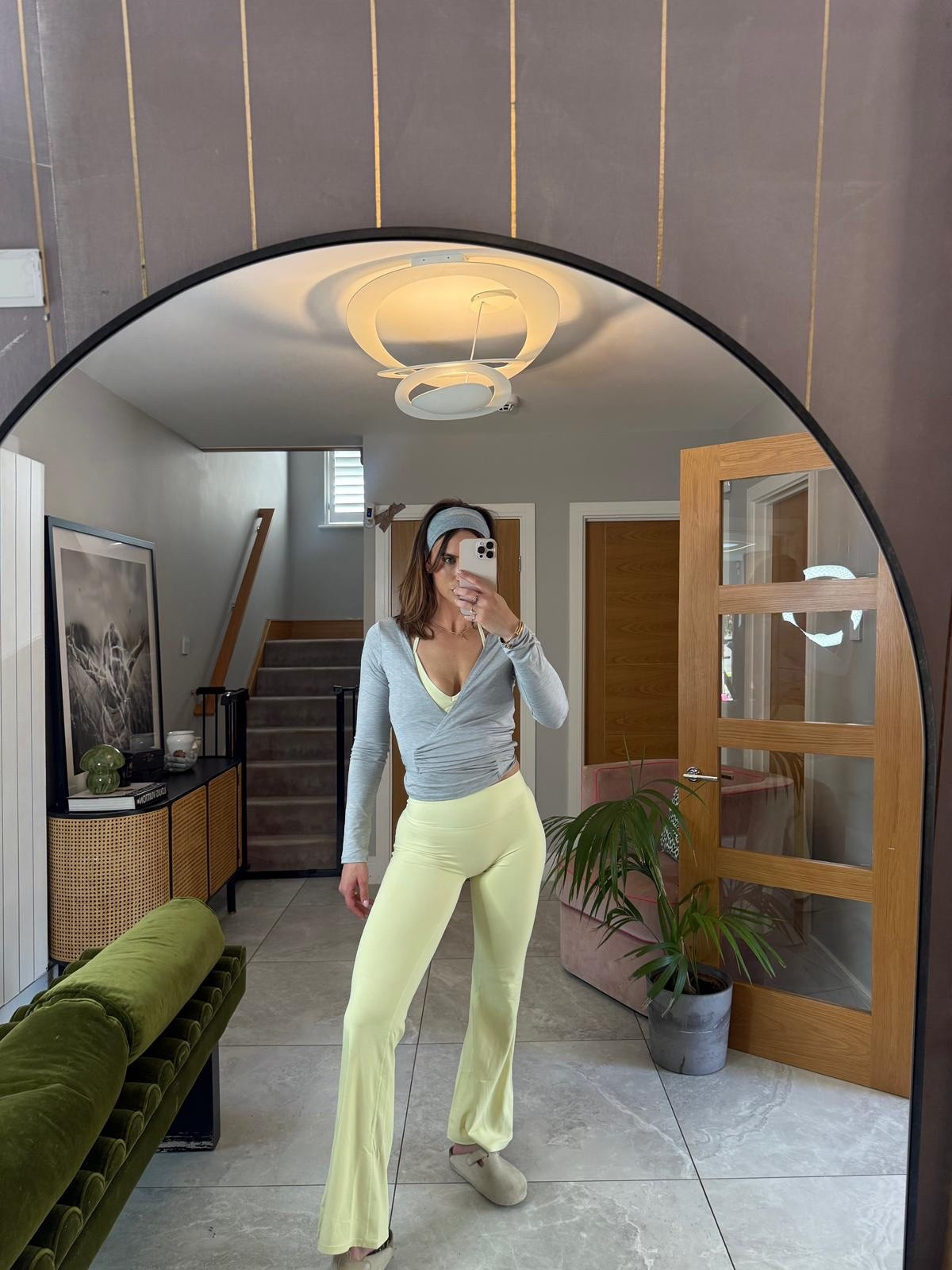 Pilates era, sunshine edition 💛

Pastel yellow flares and matching sports bra, layered with a soft grey wrap top, hairband in, and finished with Birkenstock clogs for that post-class comfort.

Soft, calm, and put together without trying too hard ✨

#LTKfitness #LTKspring #LTKstyletip