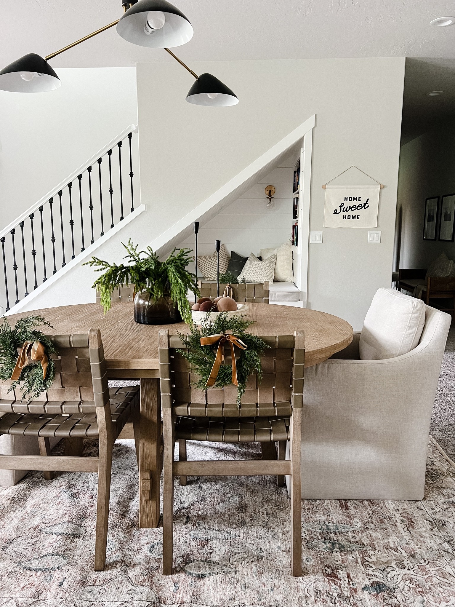 First holiday looks in our basement! 

Mini wreaths, chair wreaths, wood table

#LTKhome #LTKHoliday #LTKSeasonal