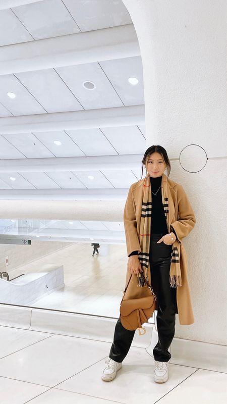 Neutral winter outfit // camel wool coat - shop the curated, turtleneck top - express, leather straight leg pants - Aritzia, sneakers - Nike, scarf - Burberry, bag - dior

#LTKstyletip #LTKSeasonal