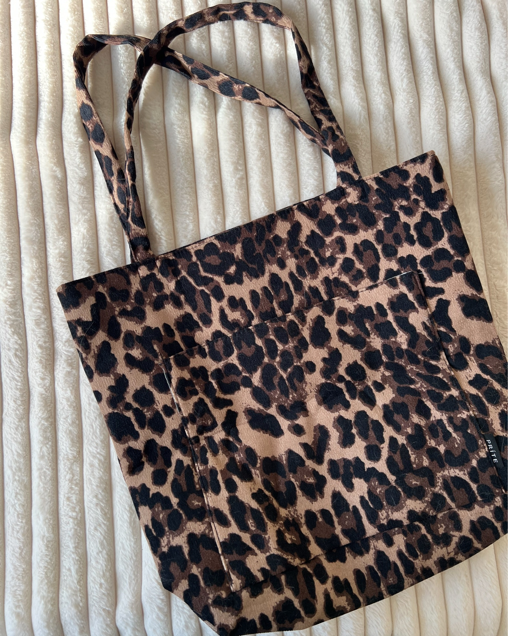 Amazon corduroy leopard tote bag - so roomy inside and has 2 inside pockets, a zip pocket, and an outside patch pocket with magnetic closure. 

#LTKstyletip #LTKbag
