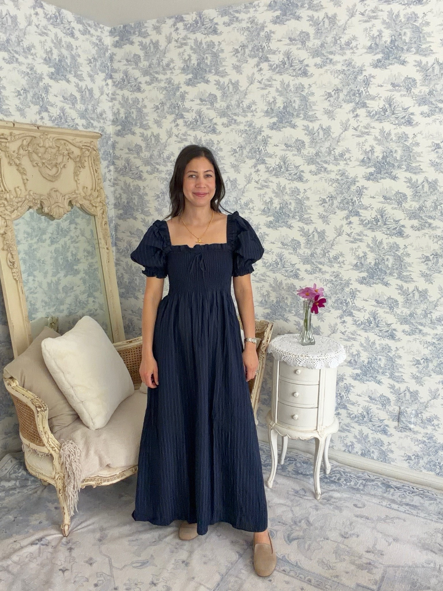 Today's outfit of the day features the Hill House Home Scarlett Midi Nap Dress, and I think it may be one of the most romantic dresses I've worn this summer.

Hill House Home is known for its iconic Nap Dresses, and I especially love this Scarlett version. It has puffed sleeves, square neckline, ruched bodice, flowing midi skirt, and yes, even pockets! They all come together to create a silhouette that feels timeless and feminine.

It reminds me of something straight out of Romeo and Juliet—graceful, romantic, and effortlessly elegant. It's the kind of dress you can simply slip on and instantly feel beautiful, whether you're hosting at home, enjoying lunch with friends, or taking an evening stroll.

Beautiful dresses like this are a wonderful addition to a ten-item wardrobe special occasion extras because one thoughtfully chosen piece does all the work.

Do you gravitate toward romantic styles like this, or is your summer wardrobe a bit more tailored?

#tenitemwardrobe #dailyconnoisseur #hillhousehome #napdress #summerstyle #romantic

#LTKdayinmylife #LTKgrwm #LTKOver40