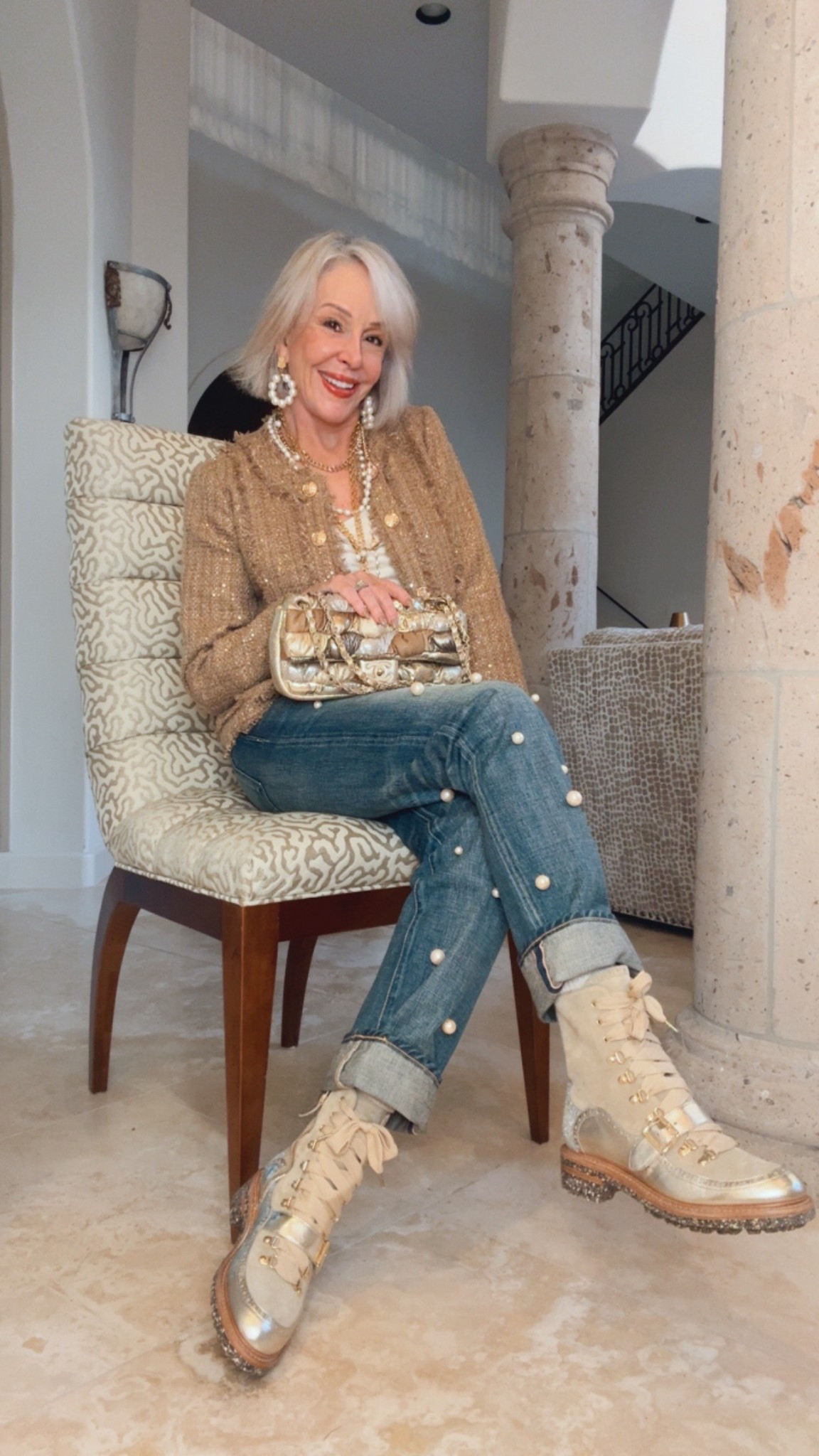  Collarless design gold tweed jacket with gold buttons.
Gold metallic combat boots with zipper
Pearl embellished jeans, gold metallic bag and gold and pearl necklace  and earrings 

#LTKOver40 #LTKSaleAlert #LTKHoliday