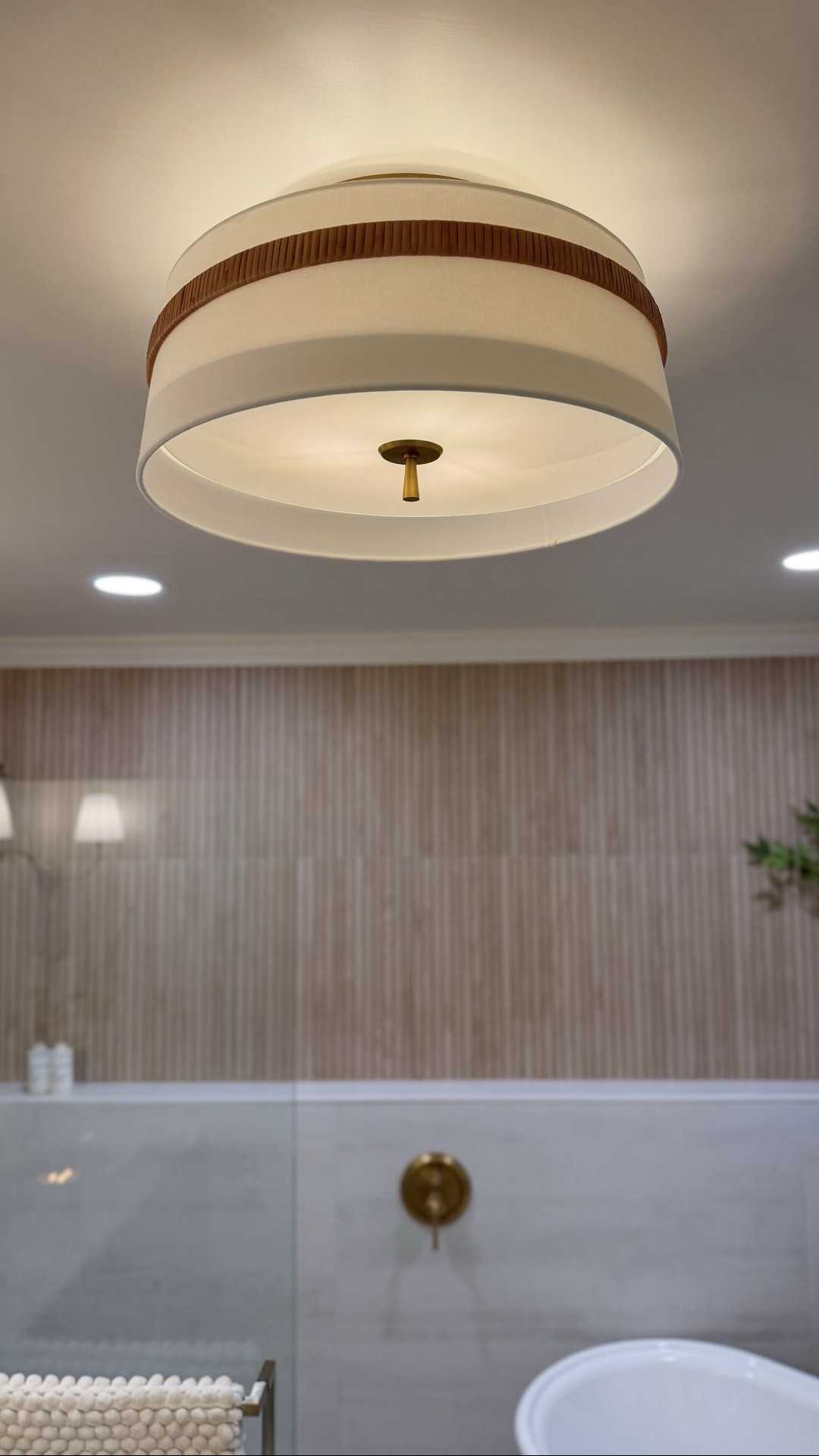 Flush mounts are often chosen to quietly blend into the background, but this one proves they can enhance the entire space. 

The Daquavion Fabric Flush Mount adds just the right amount of texture and detail, complementing the bathroom beautifully without competing with the rest of the design.