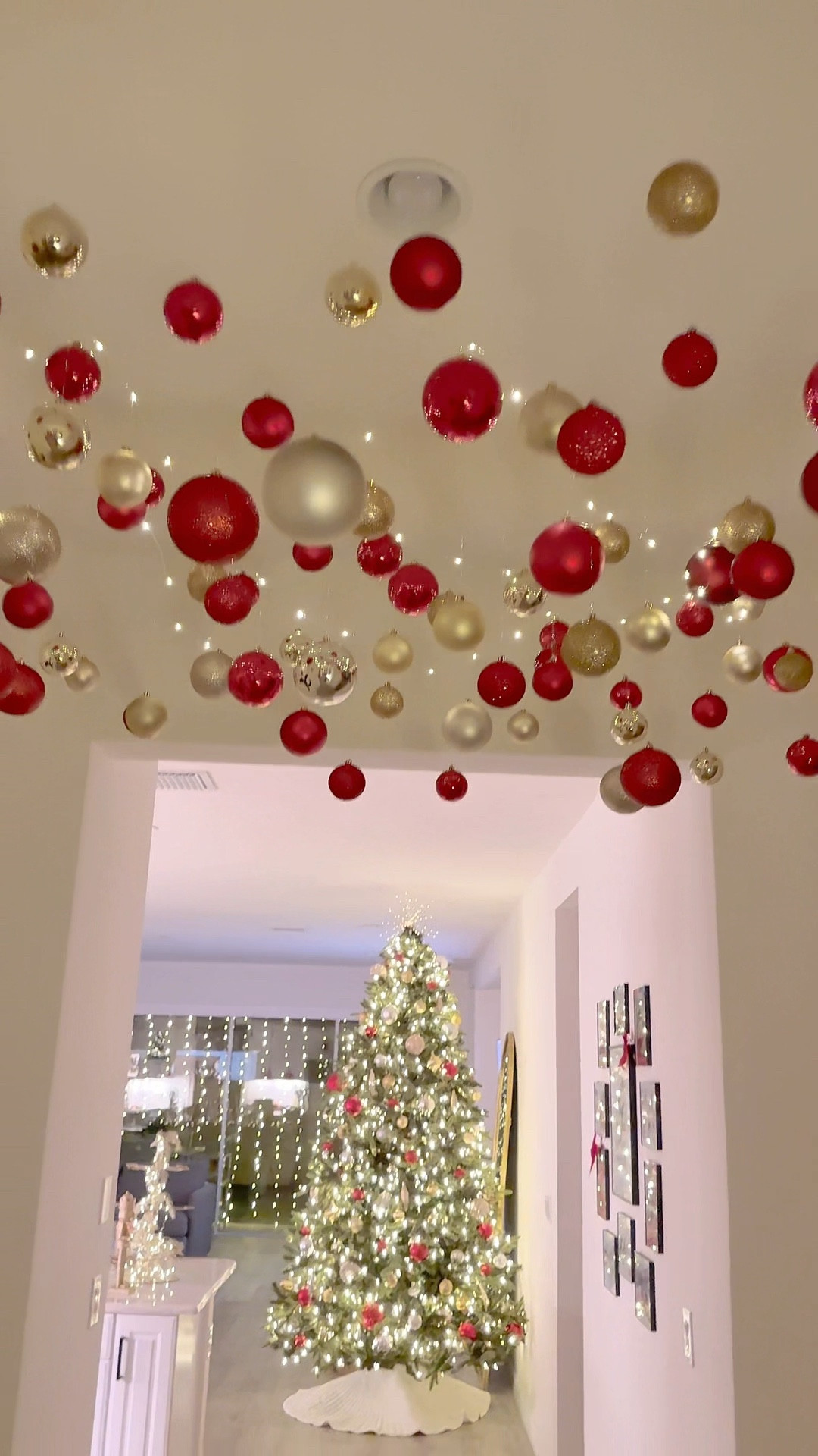 Easy Christmas decor idea! Hang Ornaments from the ceiling and add twinkle lights! 

#LTKHoliday #LTKHome #LTKSeasonal