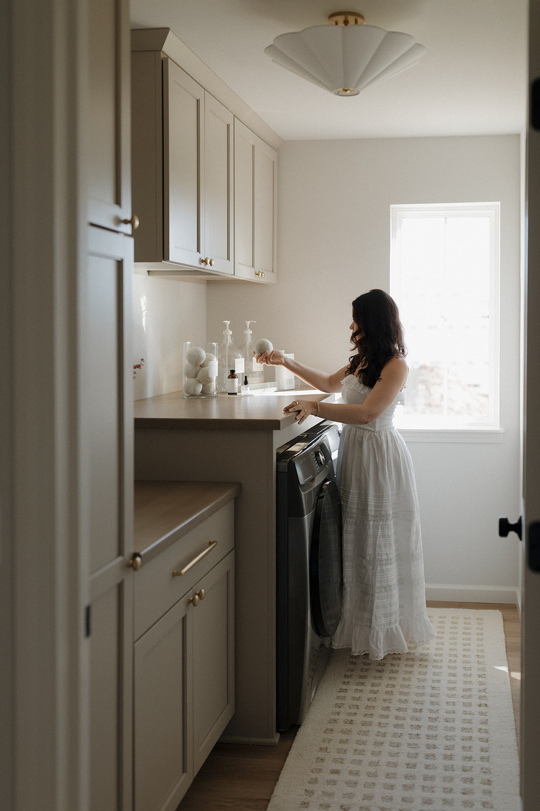 Shop everything in our laundry room! // Wall Color: First Star by Sherwin Williams // Flooring: Coretec LVP in Springfield Oak  // Cabinets: Custom by Countryside Cabinets in Oyster (Cabinets) and North Pier (Countertop)  

 #LTKHome