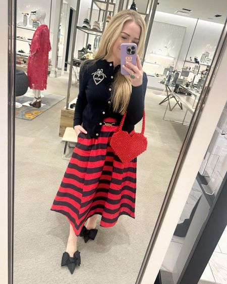 Lunch with my favorite valentine ❤️ (also will be perfect in Paris this spring with a classic black or navy bag…❌⭕️)  👀 Fit! Skirt has elastic on the back so sizing is pretty easy. I ended up sizing down one size. Usually a 6 and kept the 4, I’m 5’4” and wearing regular, not petite. Shoes fit true to size. (Heart bag is an old boutique find. Sweater is @lelioncollection) 
