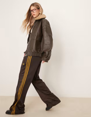 adidas Originals Firebird track pants in brown | ASOS (Global)