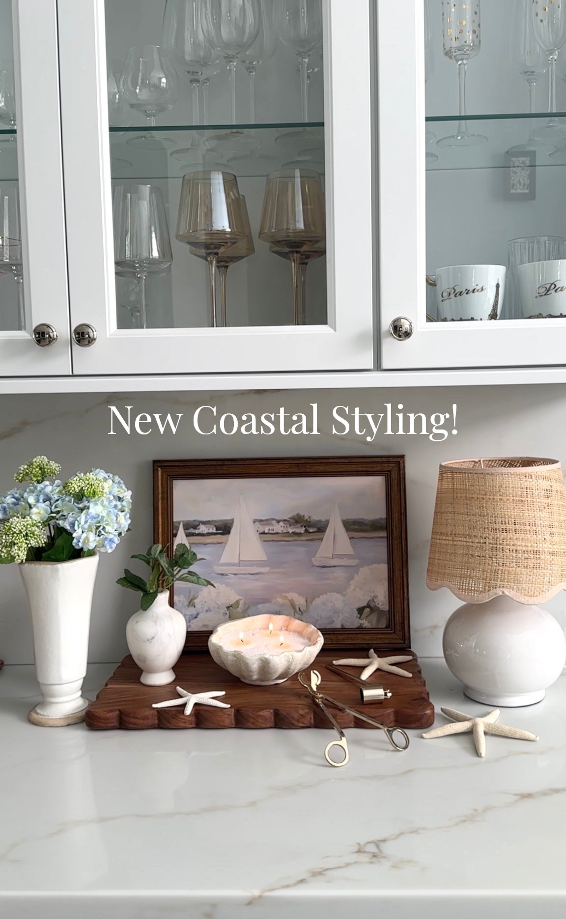 New coastal styling, decor I’ve been adding to my home for spring to summer! Shop vases, florals on sale, shell candle, scallop shade lamp, wood board, marble vase, wine glasses, candle accessories, hardware+ more coastal home inspired links! Amazon home, Wayfair, Pottery Barn, McGee & Co, etú home, Michael’s 

#LTKdayinmylife #LTKSaleAlert #LTKHome
