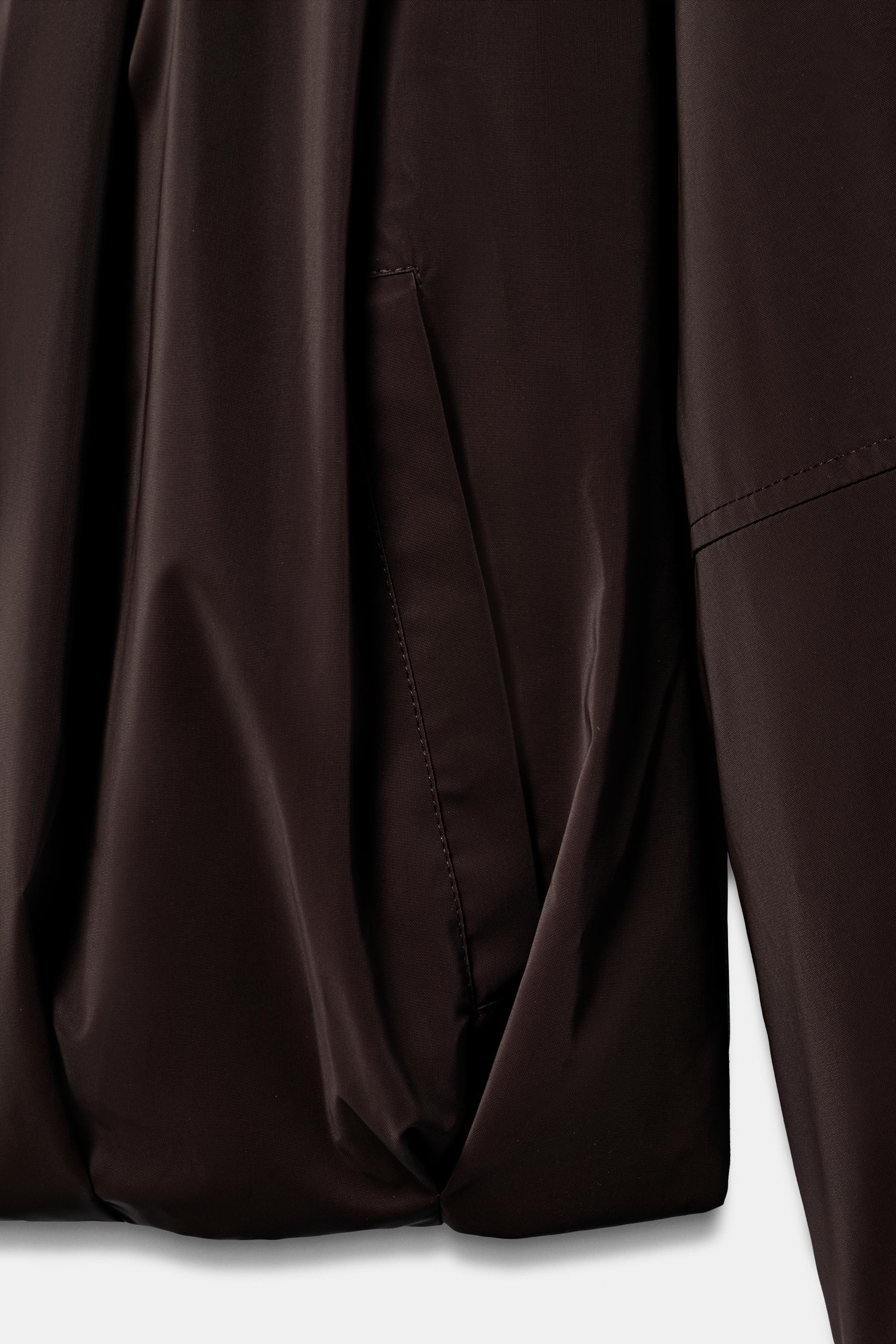 Jacket featuring a high collar, an adjustable hood with elastic drawstrings and long sleeves. Fro... | Zara UK