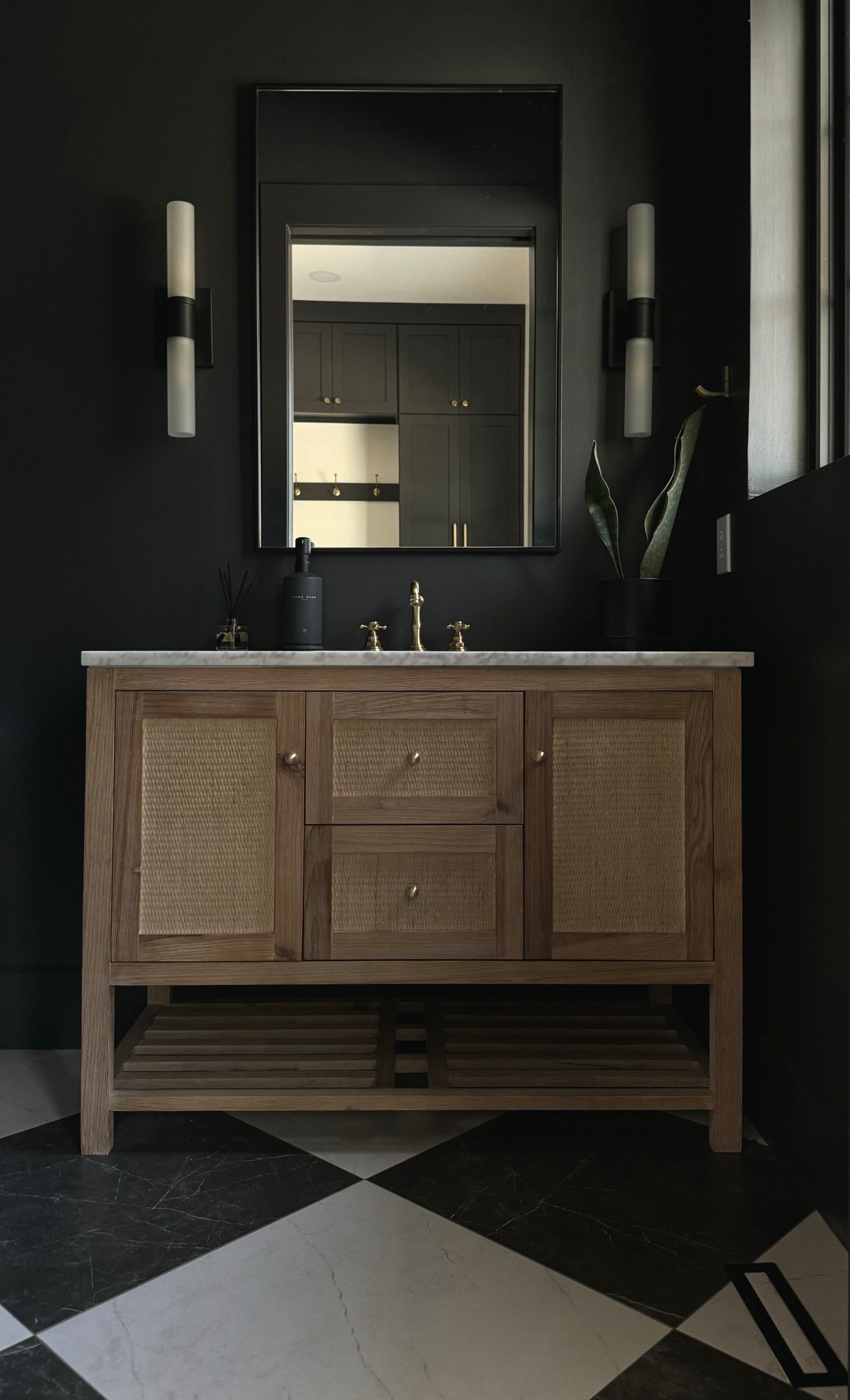 A moody powder bath moment 🖤✨ Can you believe I bought this vanity online? I swapped the knobs that came on it for these brass knobs to give it a more elevated and custom look for less 

#LTKHome #LTKSaleAlert