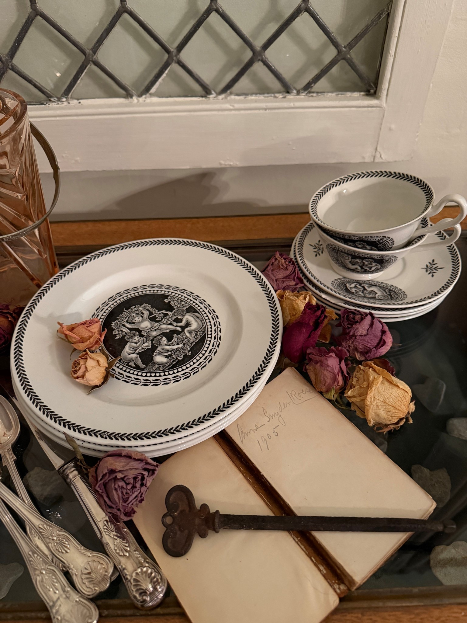 💕𝒱𝒾𝓃𝓉𝒶𝑔𝑒 𝒟𝑒𝒸𝑜𝓇
Collecting supplies for a Valentine table later this week and remembered this cherub tea set my dad gave me that was my grandmother’s.  Gathered everything together on her curio cabinet that I have since filled with heart rocks I find on my walks.  Anyone else do this?  At least 4 of her grandchildren do!  Added rose colored glasses & an ice bucket, dried roses & a book that she wrote her name in circa 1905. 

#vintagedecortour 
#lovevintagedecor #valentineplates #antiquevalentine
