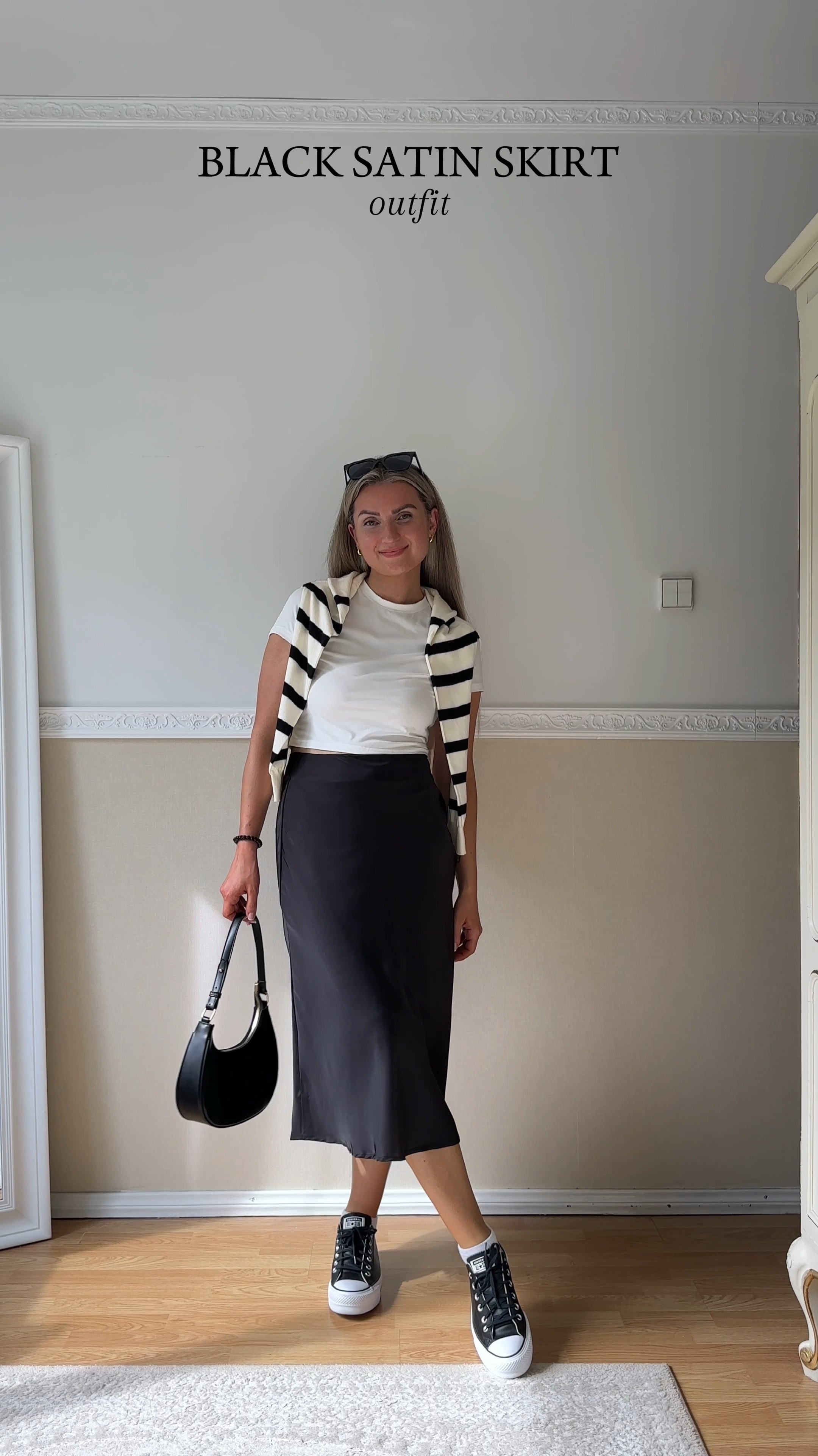 Another super simple and easy last minute outfit inspo 🖤 

Styling a black satin midi skirt with a white solid baby tee, striped sweater, a black mini shoulder bag and black Chuck Taylor All Star Lift Platform Converse kicks ✌️😎

#LTKWorkwear #LTKFindsUnder100 #LTKStyleTip