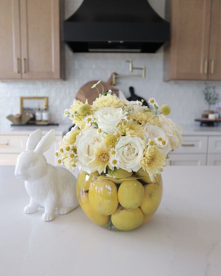 Get ready for Easter and spring gatherings with a fresh centerpiece idea! Add lemons (fresh or faux) into your base and top it off with your favorite flowers for a beautiful and unique display. It also makes a perfect hostess gift!

Home decor, gifts, glass floral vase 

#LTKhome #LTKstyletip #LTKfindsunder50