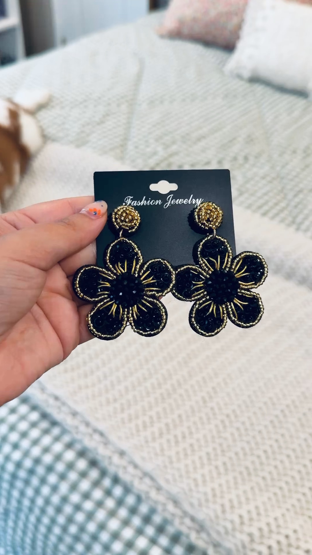 Cutie lil beaded black + gold flower earrings! 

 