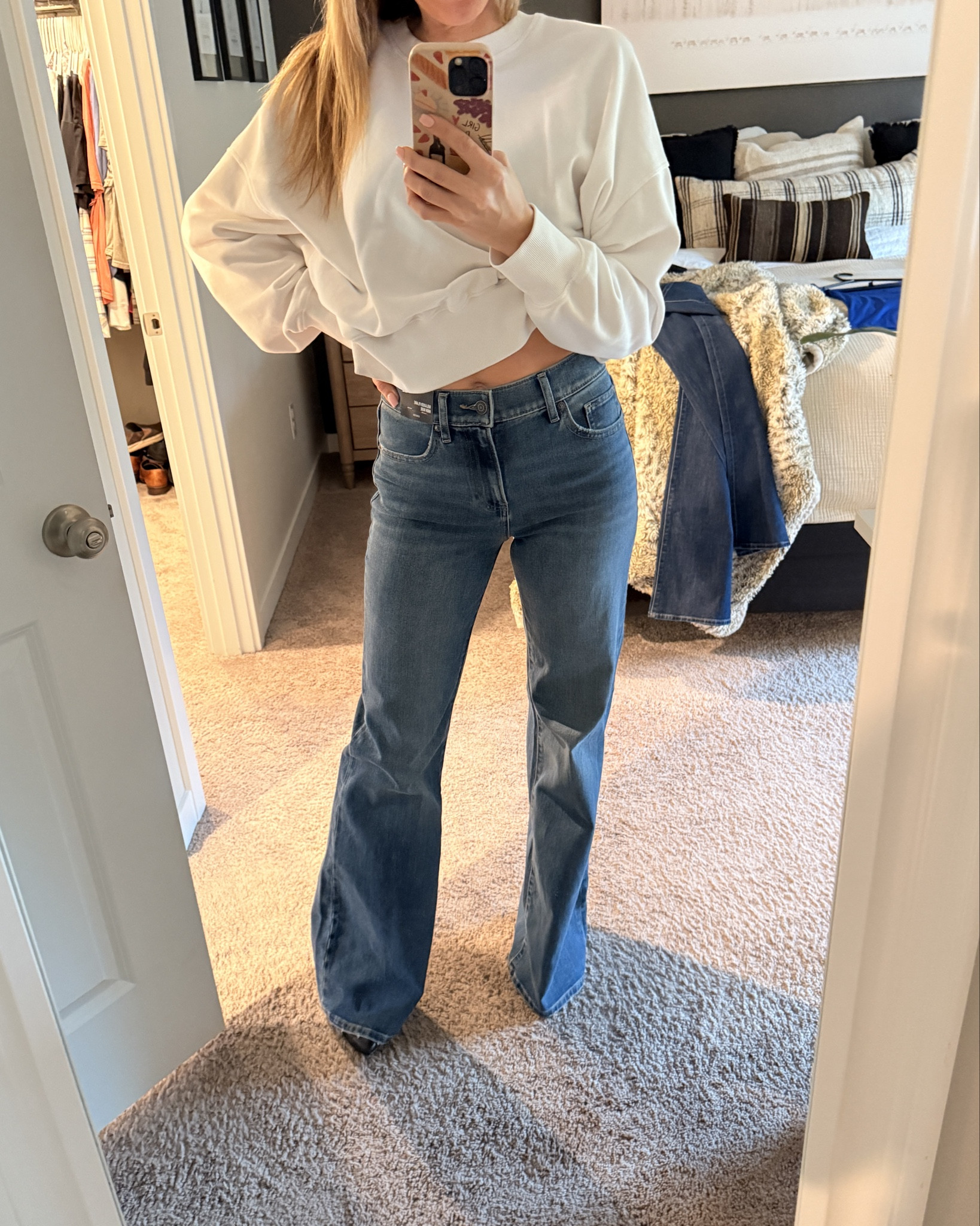 High waisted medium wash relaxed flare jeans! They fit PERFECT. They remind me of the Victoria Beckham jeans! Denim. If you’re in between sizes --size down. ￼

#LTKOver40 #LTKgrwm #LTKootd