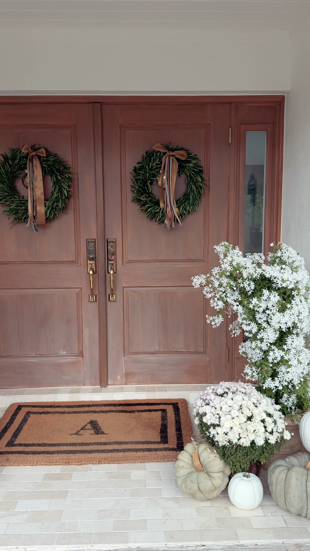 Pumpkin porch 🍃🚪🤍  Sharing the before and after and linking our favorite fall front door finds. #pumpkin #frontdoor #beforeandafter 

#LTKHoliday #LTKHome