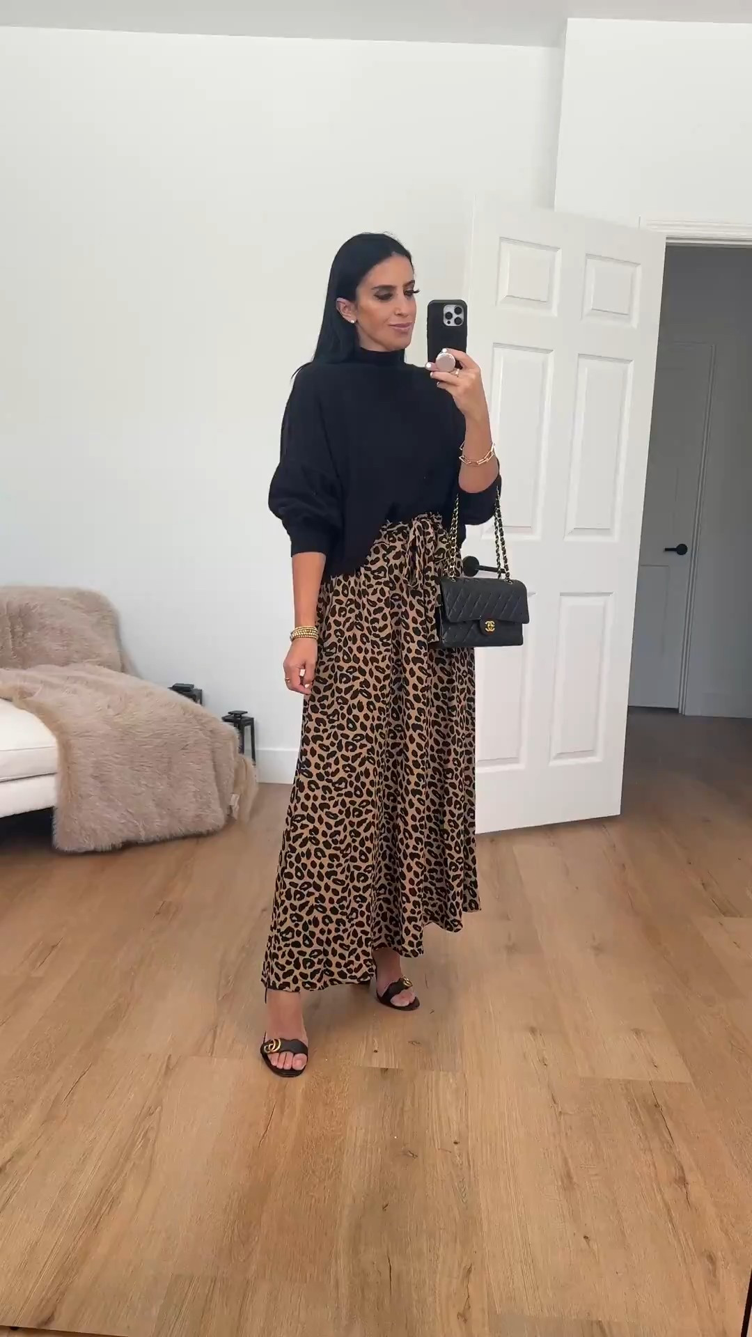 Leopard print mxi skirt from Amazon under $30. Black turtleneck sweater. Gucci heels