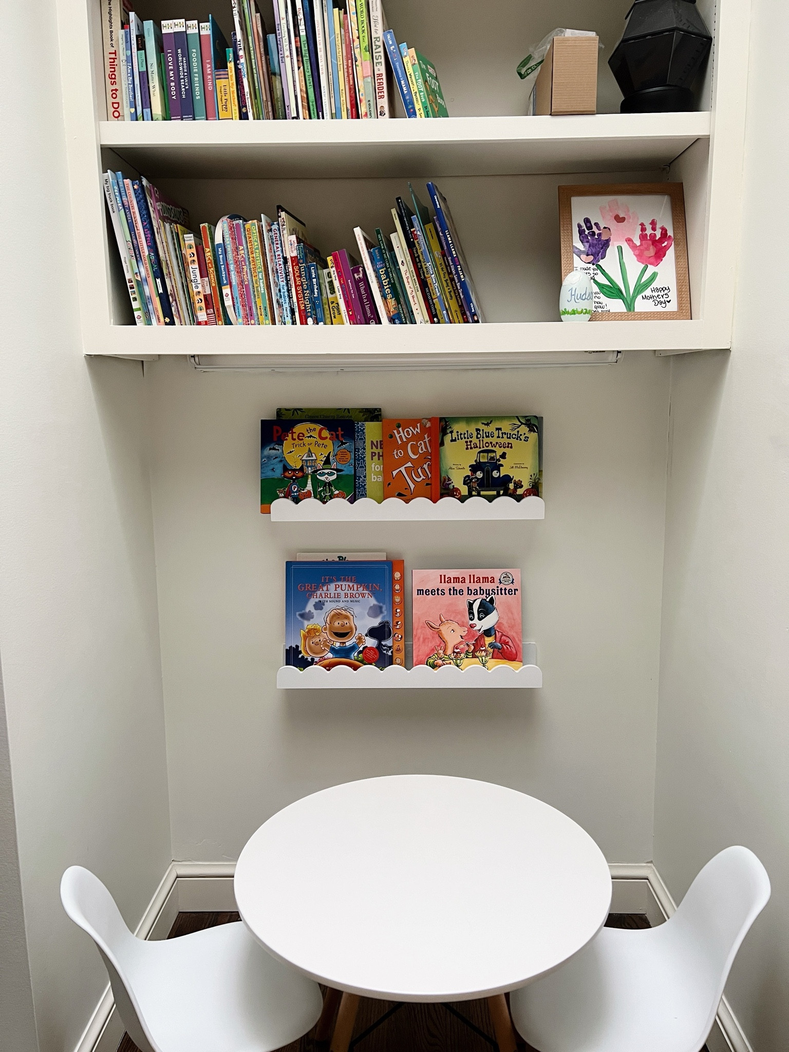 Love a book nook! 

Bookshelves, scalloped bookshelves, kids table and chairs 

#LTKKids