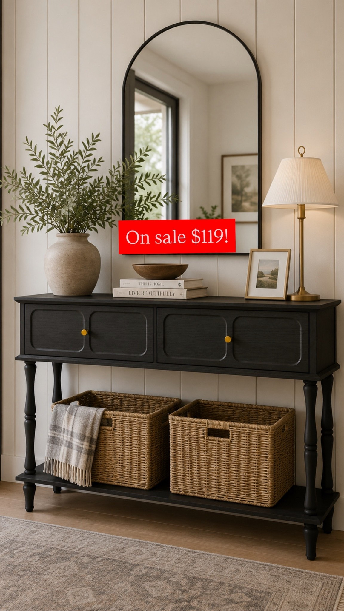 Love this black console table. Found great deals on the arched mirror and buffet lamps as well!

#LTKHome #LTKSaleAlert