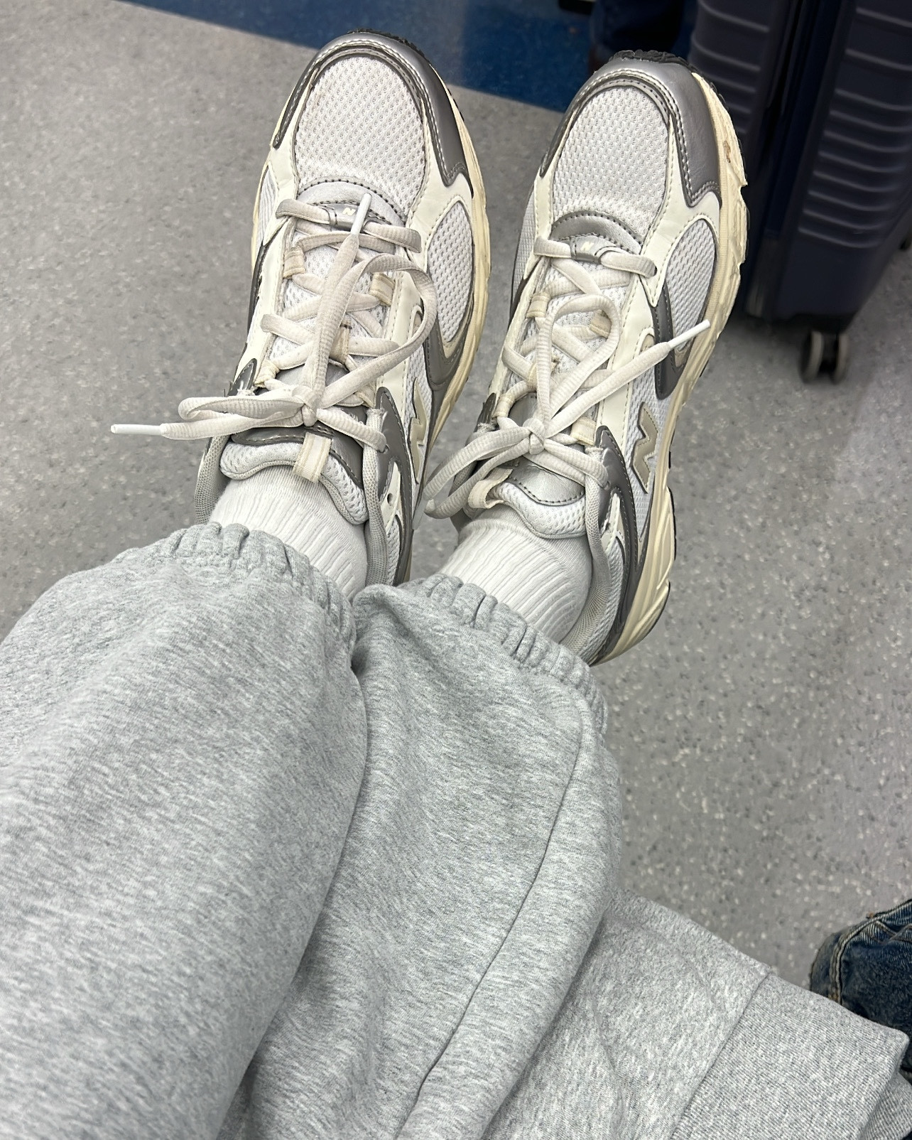 Travel essentials, new balance sneakers, white graphic crew socks, grey athletic sweats  

#LTKTravel