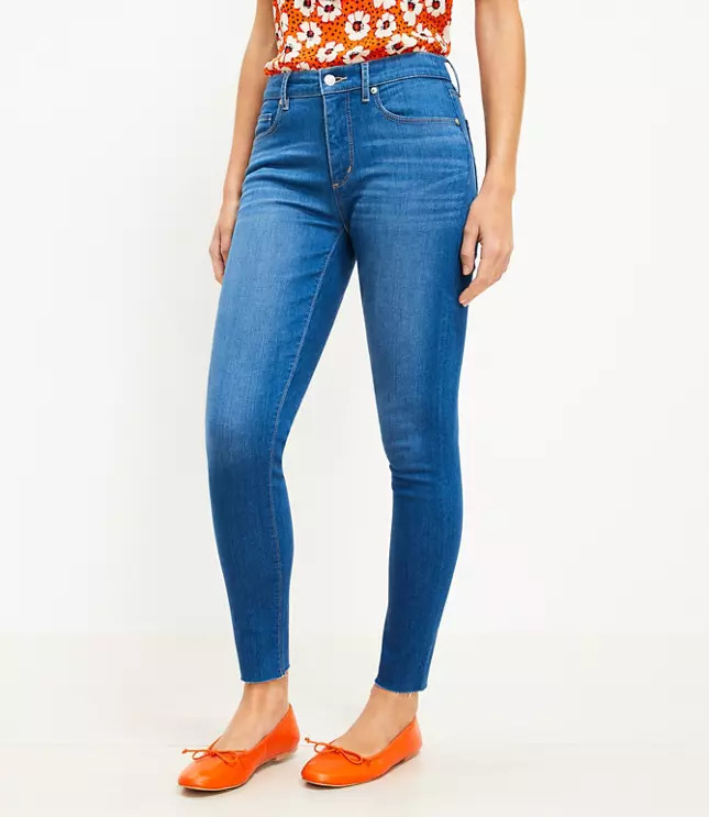 Curvy Chewed Hem Mid Rise Skinny Jeans in Bright Mid Vintage Wash | LOFT