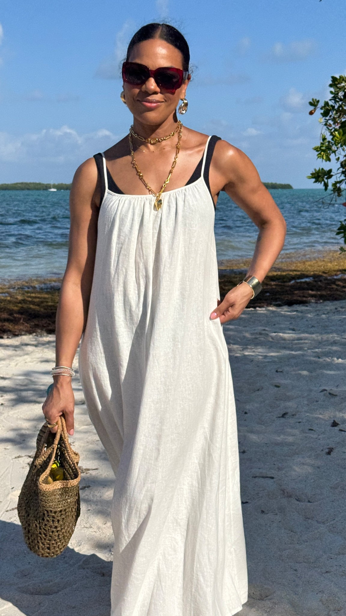 Beach OOTD: linen dress, black bikini, lined tote bag, gold hardware sandals, and gold accessories. Dress is tts & color oak. 

#LTKStyleTip #LTKTravel #LTKOver40