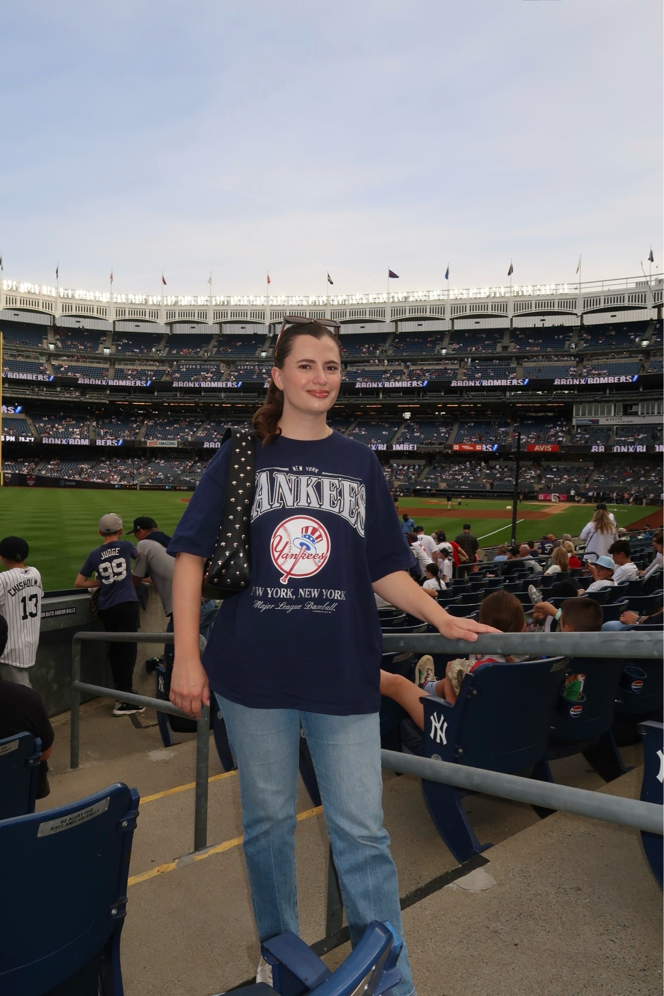 What I wore to the Yankees game last night! Love an oversized vintage tee paired with my light wash jeans. I also threw in my studded purse.

#LTKSeasonal #LTKootd