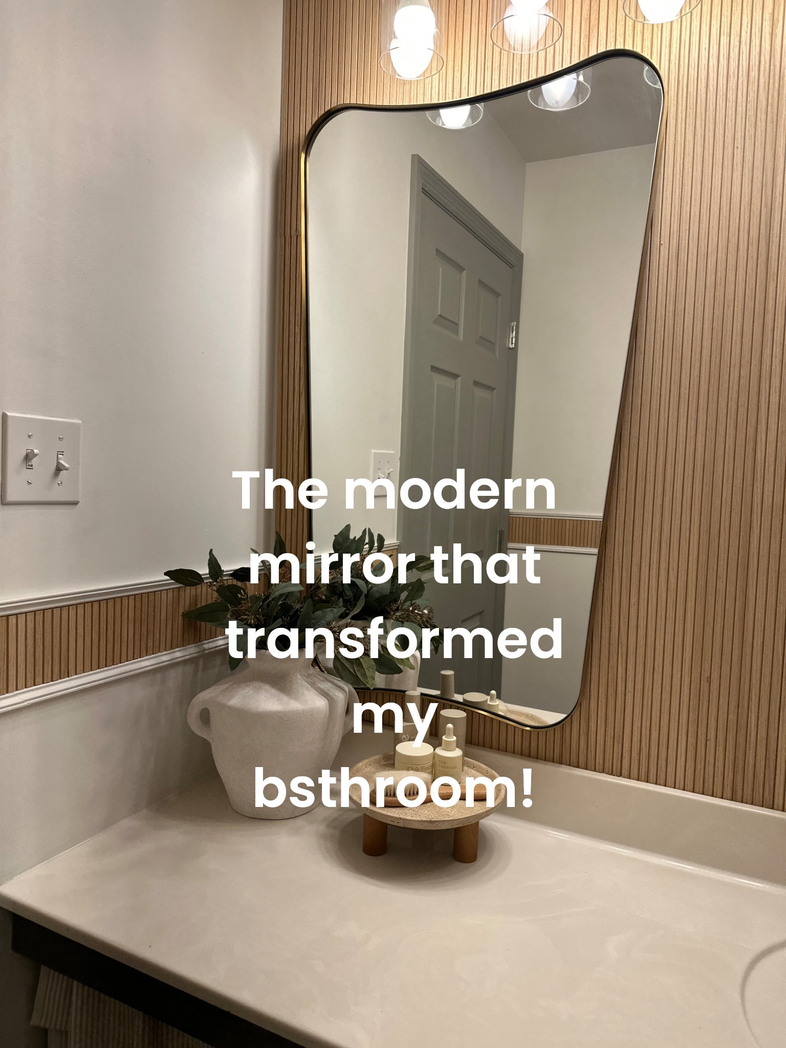 The prettiest gold modern mirrors that totally transformed my boring bathroom!!

#LTKHome