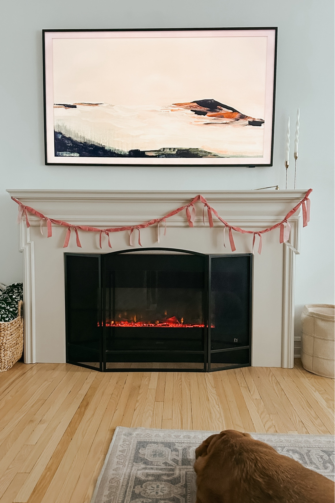 Subtle Valentine’s decor with a pink ribbon bow garland, frame TV art and spiral candles. 

#LTKcasa #LTKwinter