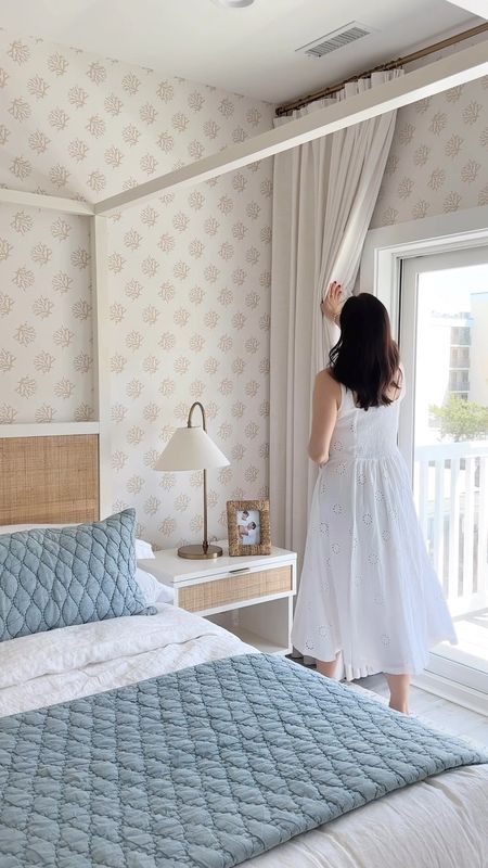Fully Pottery Barn furnished coastal primary suite - from the coral neutral wallpaper to the white canopy bed and cane nightstands and dresserrs

#LTKHome #LTKStyleTip #LTKVideo