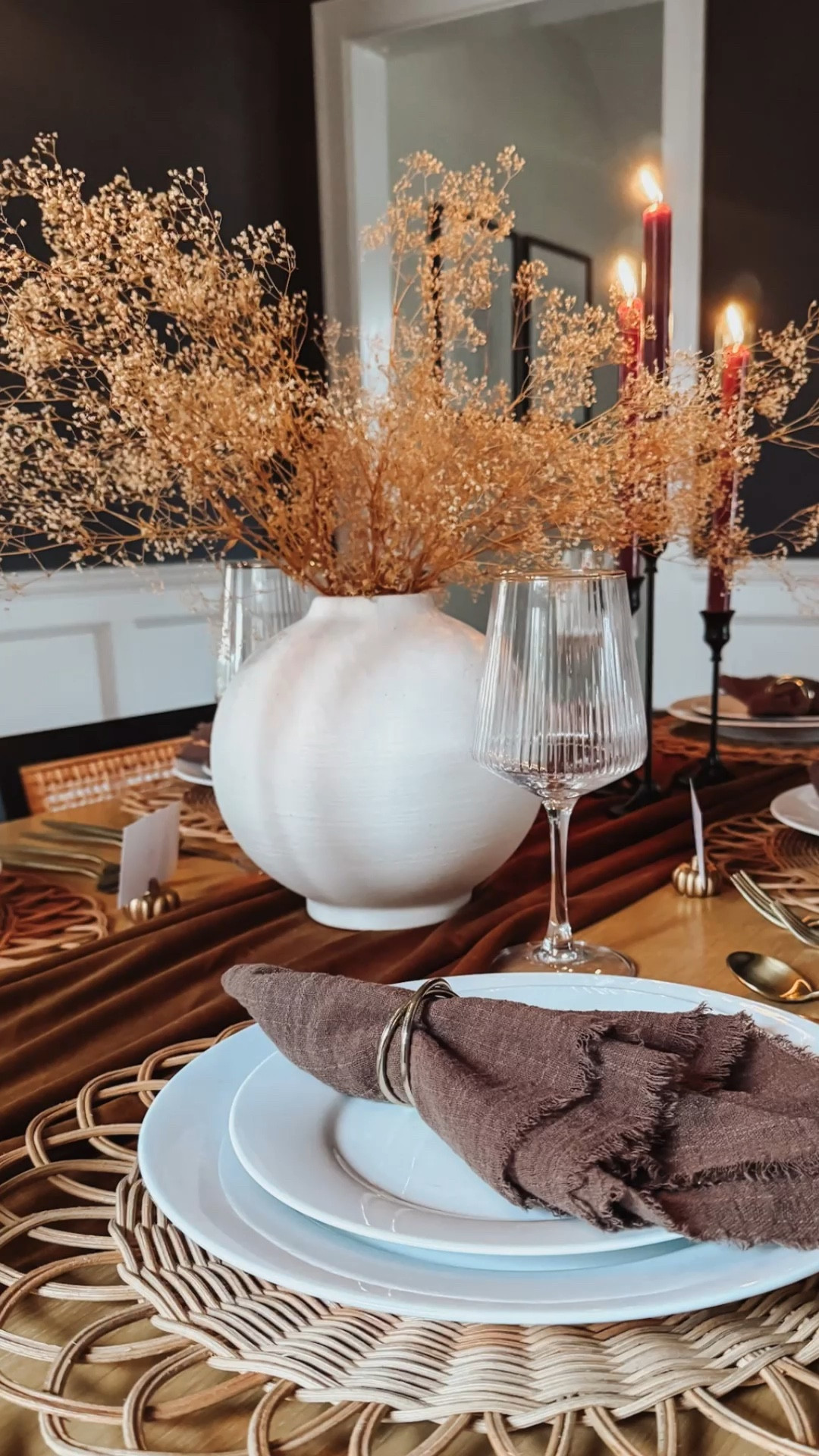 Neutral Thanksgiving table setting 🦃 with a velvet table runner, linen blend napkins, woven chargers, burgundy taper candles, fluted glasses, and dried floral centerpiece 🤎 NOTE: If you try this look, be sure there is enough space between the candles & dried flowers to be safe)

#LTKHome #LTKHoliday #LTKWatchNow