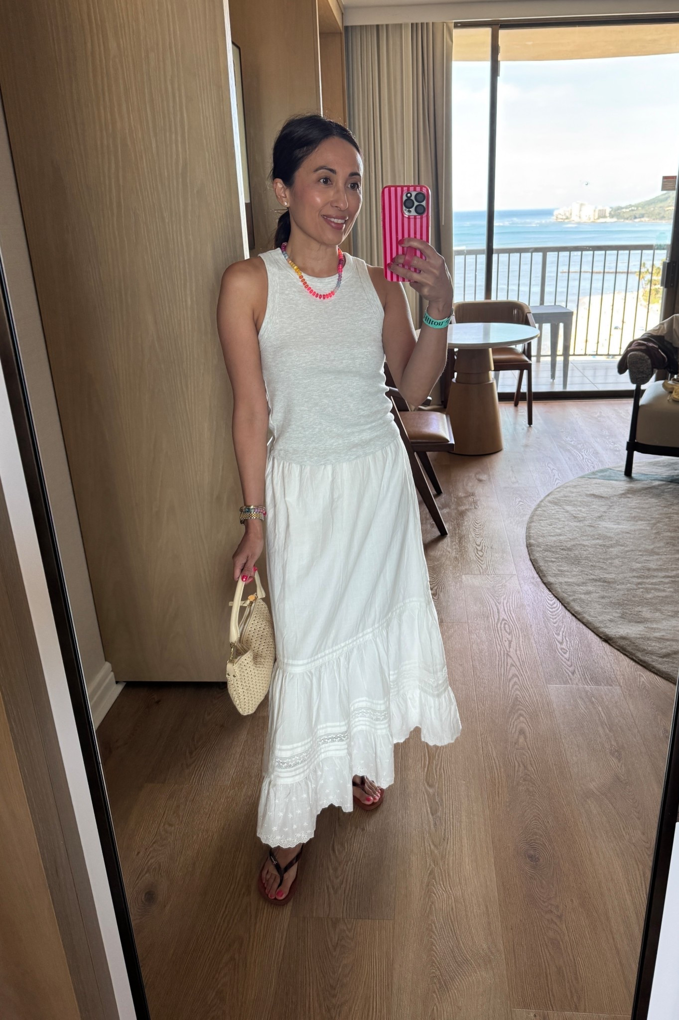 Vacation outfit. Spring break. 
White skirt. White maxi skirt. All cotton with embroidery. Lined. Elastic waist and drawstring. True to size. Wearing regular length. Pretty classic feminine design. 
Tank top is a snug style, so I size up. 
Woven handbag. 
Comfy flip flops. 
Colorful stone necklace. 



#LTKootd #LTKOver40 #LTKTravel