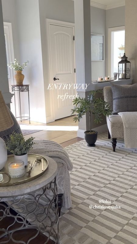 Entryway refresh for spring! Shop my beautiful new neutral area rug, textured throw pillows on sale, (ad) potted olive tree, black scallop mirrors on sale, touch light, candle, vases, spring florals, scallop planter.  Rugs Direct, Amazon home, Target, Pottery Barn, Kirkland’s home. Sales, free shipping. 

#LTKVideo #LTKhome #LTKsalealert