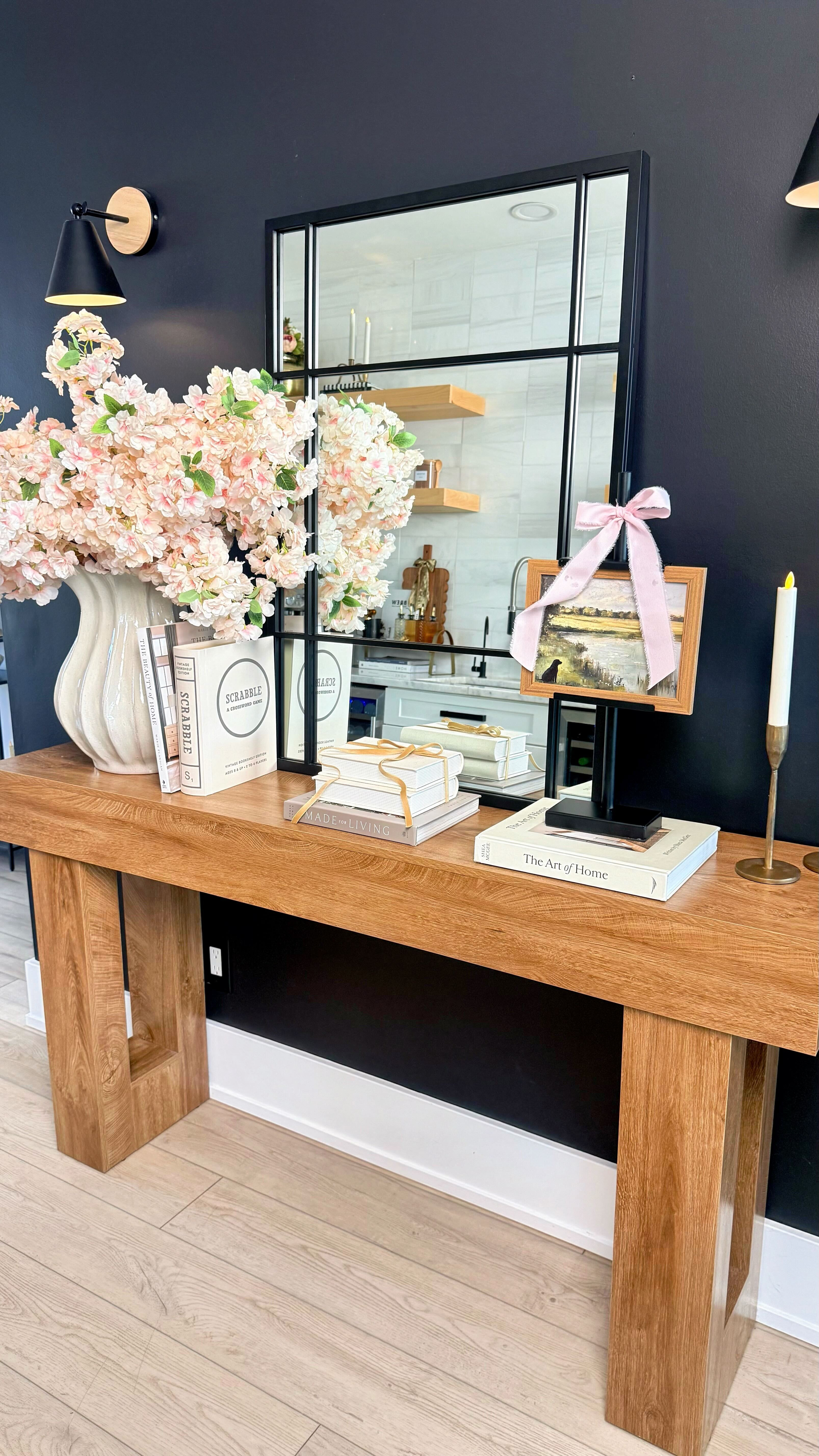 DESIGNER CONSOLE LOOK - without designer prices

This is one of those stylings that instantly elevates a space without trying too hard. By mixing warm wood tones, soft florals, layered books, and a few simple accents, this console feels curated, timeless, and high-end. Yet everything is budget-friendly and easy to recreate. Proof you don’t need custom furniture or luxury price tags to get a designer look at home.  

 #LTKHome #LTKFindsUnder50