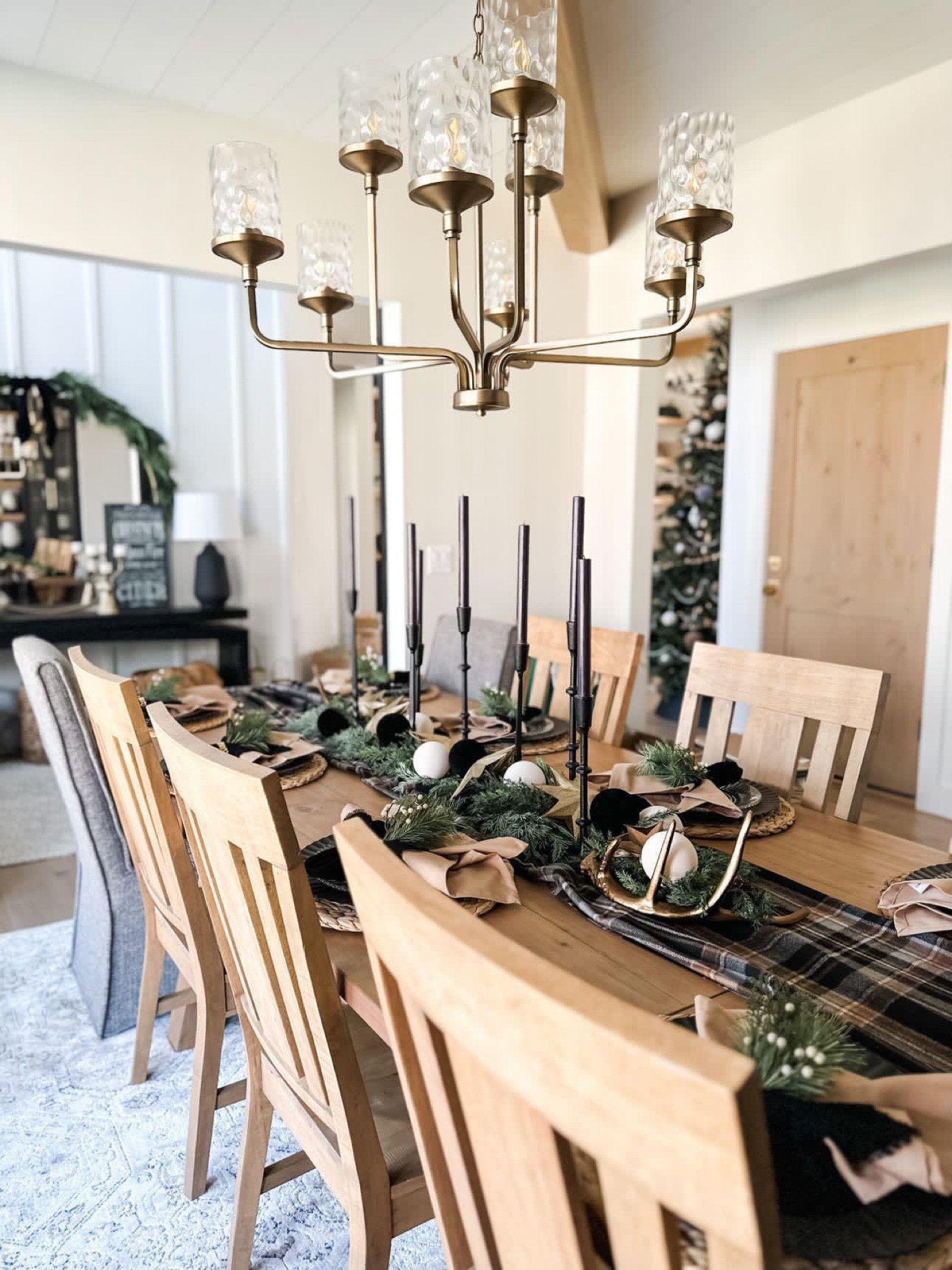 Christmas/holiday dining tablescape. Neutral colors with black, camel, white and gray. Table, chairs, plates, candlesticks and more decor 

#LTKhome #LTKHoliday #LTKSeasonal