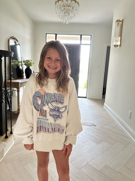 My Charlotte in her Charlotte Hornets sweatshirt from Abercrombie! SO cute and on clearance for under $20 right now!!! Snag before it’s gone, this is actually an adult sweatshirt so we can share! It’s a small and hits right at my waist for a classic fit and an oversized fit for her. We love it! So cozy🫶🏼

#LTKStyleTip #LTKKids #LTKFindsUnder50