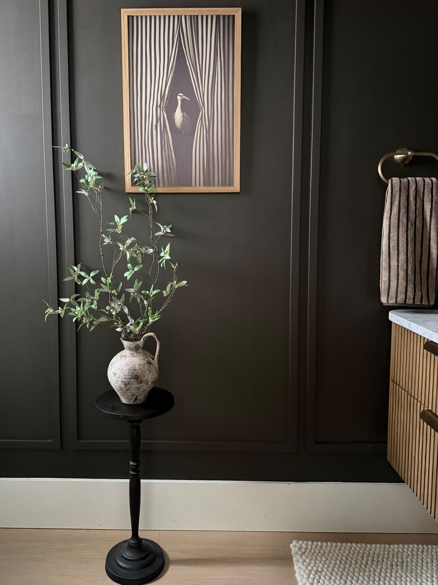 I love using fun artwork in the bathrooms. Dark wall is bringing the mood to our small powder room. SW clove 