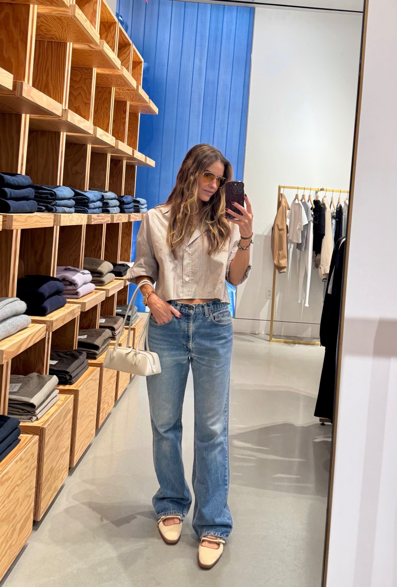 the only button-down you’ll ever need🤎 it’s updated with a sleeve that actually stays in place & doesn’t fall down! 

i’m more than obsessed i have like 4 different colors & fabrics rn lol

it runs tts i wear the xs 

+ shop the shoes of fall 2025 they are the most comfy flats you’ll ever own 

& sunnies & my vintage denim too! 

#LTKStyleTip #LTKWorkwear #LTKShoeCrush